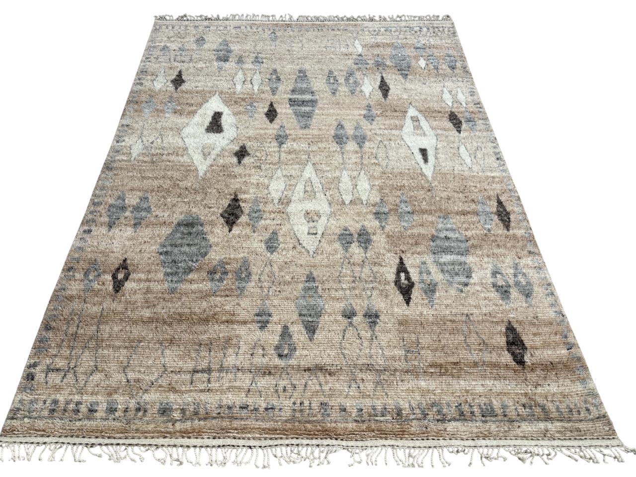 Elevate your living space with the exquisite charm of this new modern hand-knotted Moroccan berber beni ourain rug, crafted with precision and care from 100% wool. Combining the allure of Moroccan design with contemporary sensibilities, this rug is