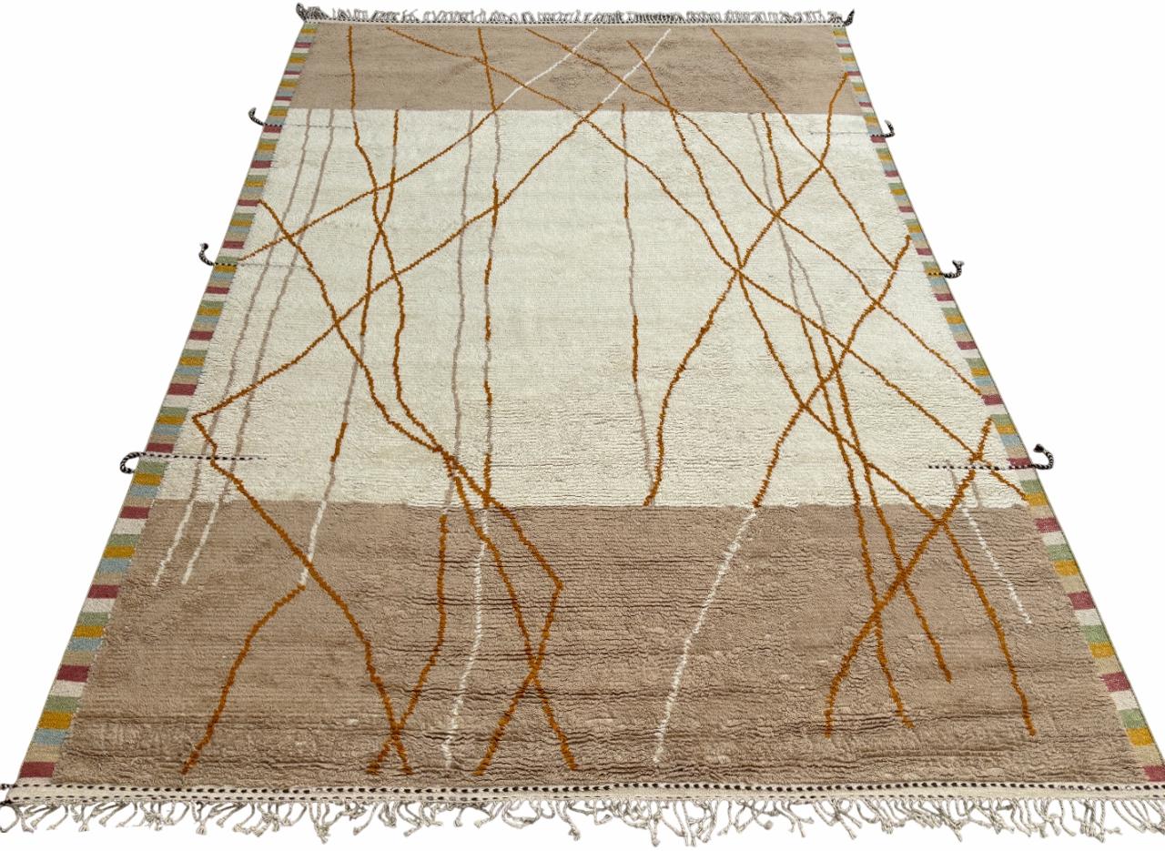 Elevate your living space with the exquisite charm of this new modern hand-knotted Moroccan berber beni ourain rug, crafted with precision and care from 100% wool. Combining the allure of Moroccan design with contemporary sensibilities, this rug is