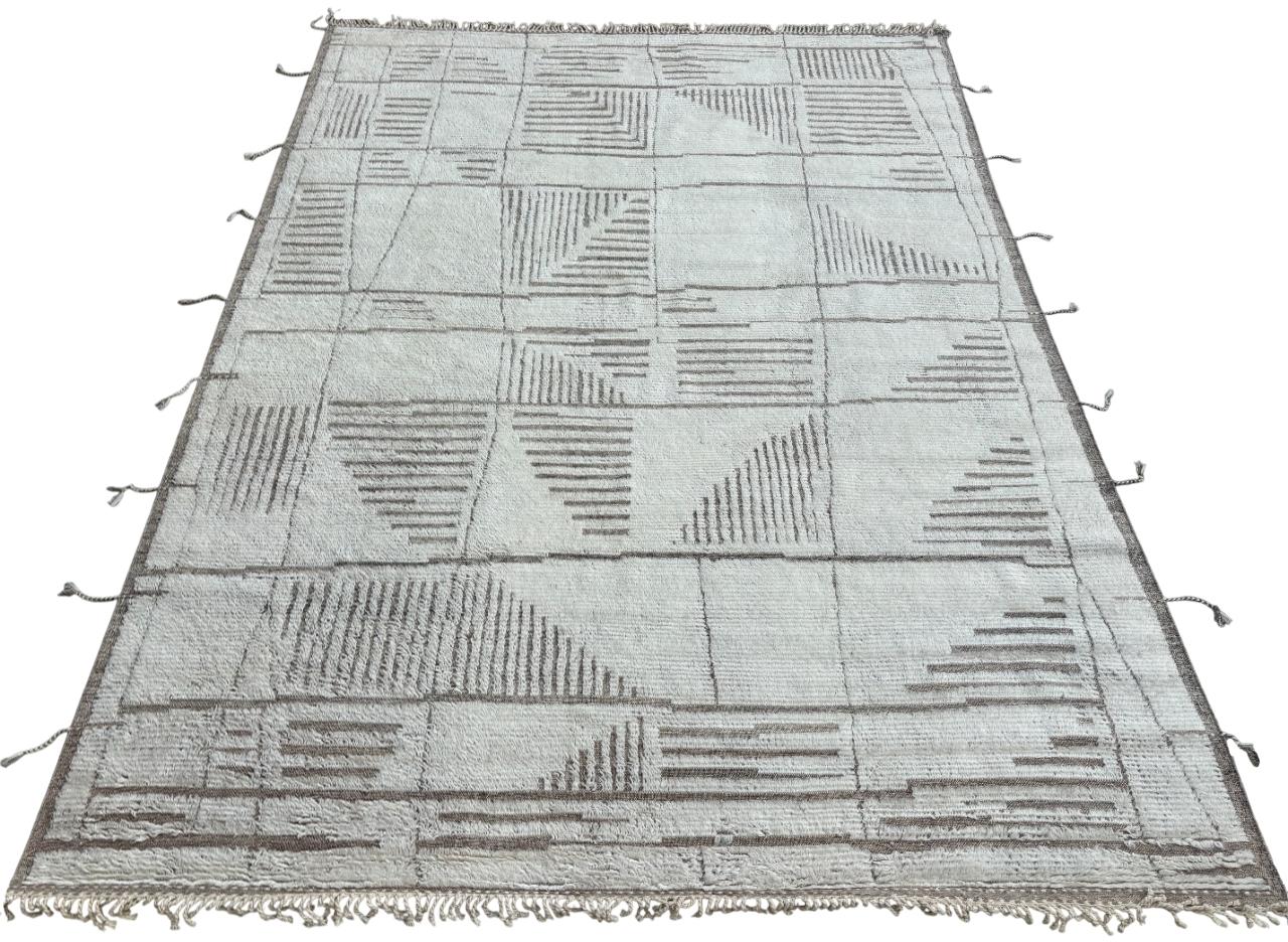 Elevate your living space with the exquisite charm of this new modern hand-knotted Moroccan berber beni ourain rug, crafted with precision and care from 100% wool. Combining the allure of Moroccan design with contemporary sensibilities, this rug is