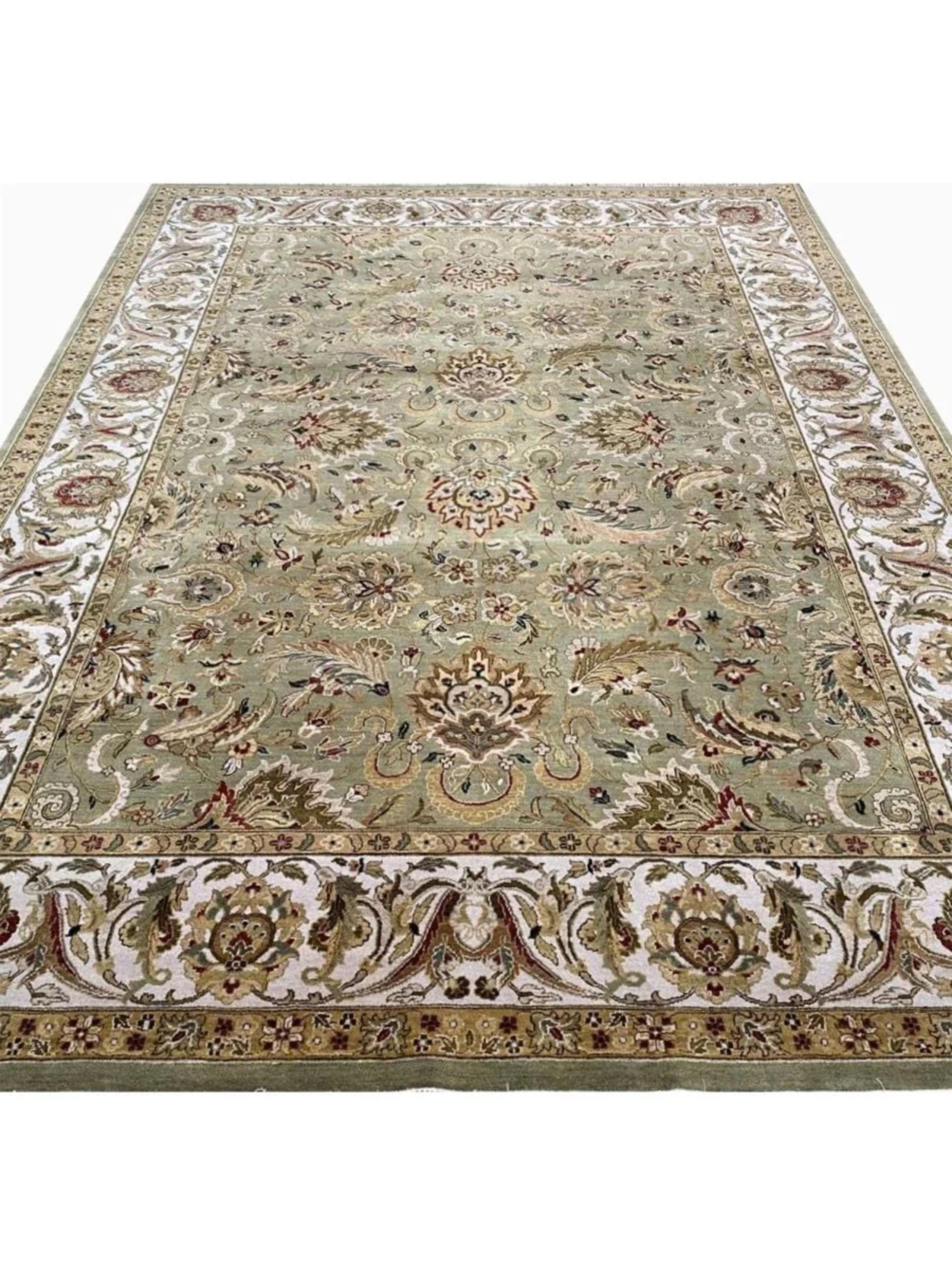 Enhance your home with the captivating beauty of this 10x14 Indian Agra area rug, a piece that reflects centuries of refined craftsmanship and artistic tradition. Handwoven in the historic Agra region of India, this rug displays a stunning all-over