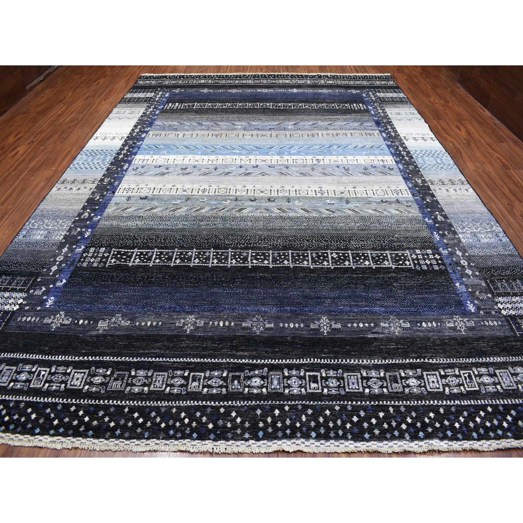 This is a truly genuine one-of-a-kind Kashkuli Gabbeh Soft Vibrant Wool Hand Knotted Charcoal Black And Blue Oriental Rug. It has been Knotted for months and months in the centuries-old weaving craftsmanship techniques by expert artisan
Primary