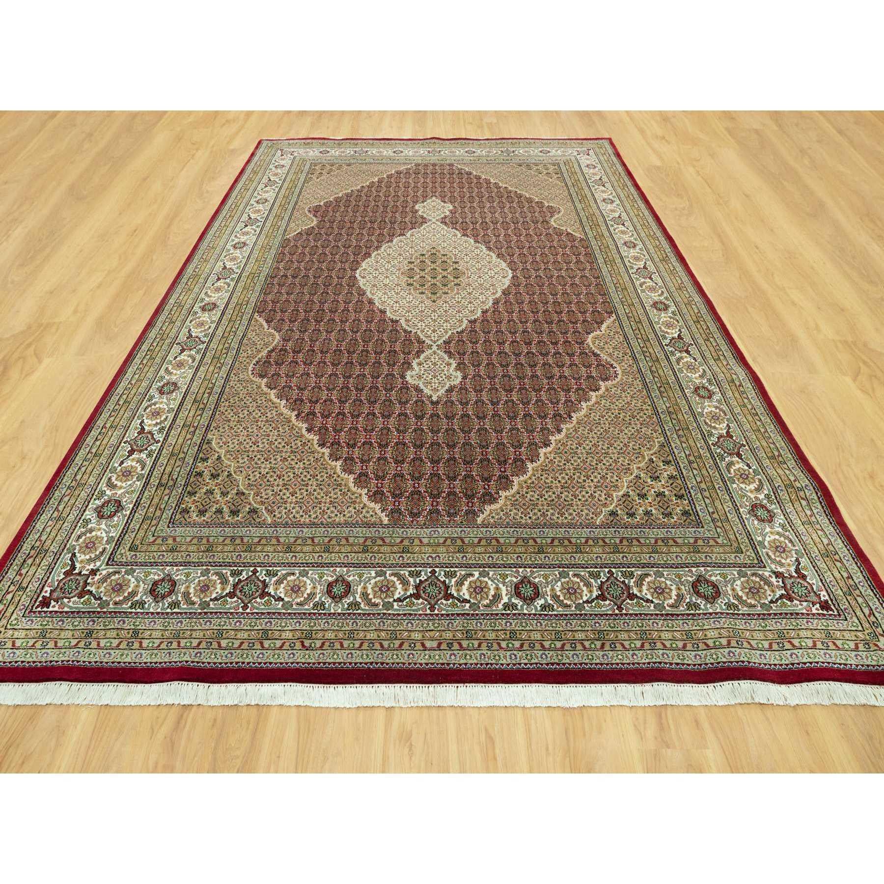 This is a truly genuine one-of-a-kind Tabriz Mahi with Fish Medallion Design, Hand Knotted, Oriental Rug. It has been Knotted for months and months in the centuries-old weaving craftsmanship techniques by artisans.
Primary materials: Wool
Latex: No