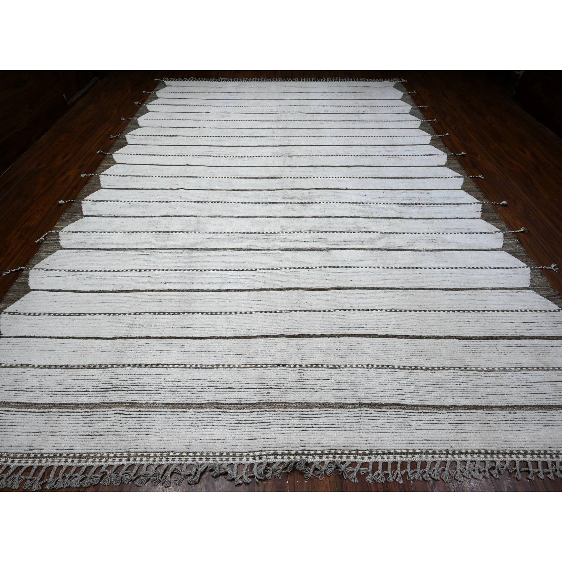 This is a truly genuine one-of-a-kind Moroccan Weave, Hand Knotted, Pure Wool, Oriental Rug. It has been Knotted for months and months in the centuries-old weaving craftsmanship techniques by expert artisans.
Primary materials: Wool
Latex: No Pile