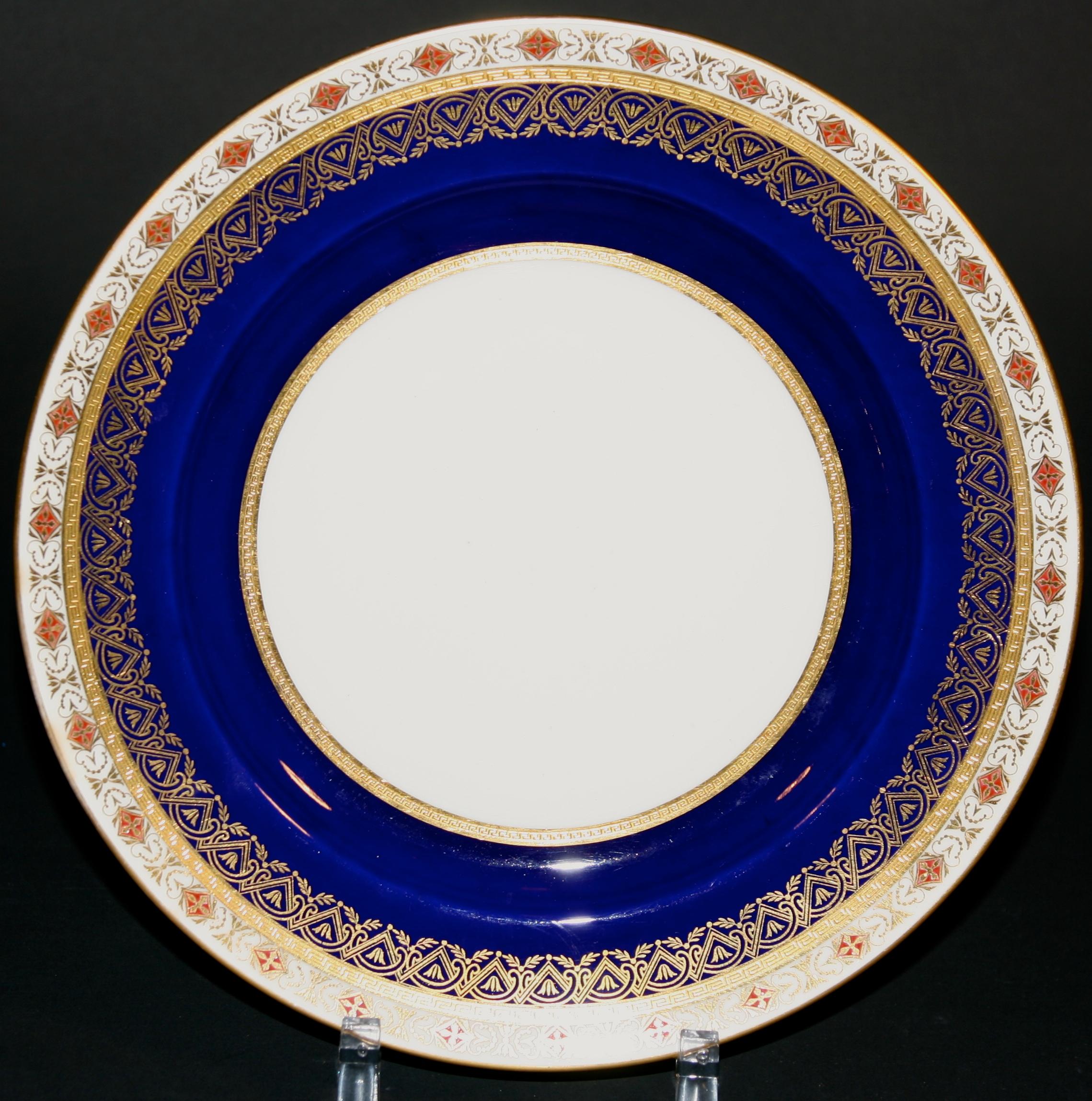 These 19th century plates from Minton, Stoke-on-Trent, England feature beautiful intricate bands containing white, rust, and 22-karat gold encrustation. They are a fine example of the intricate enamel designs Minton was capable of. Made for Gilman