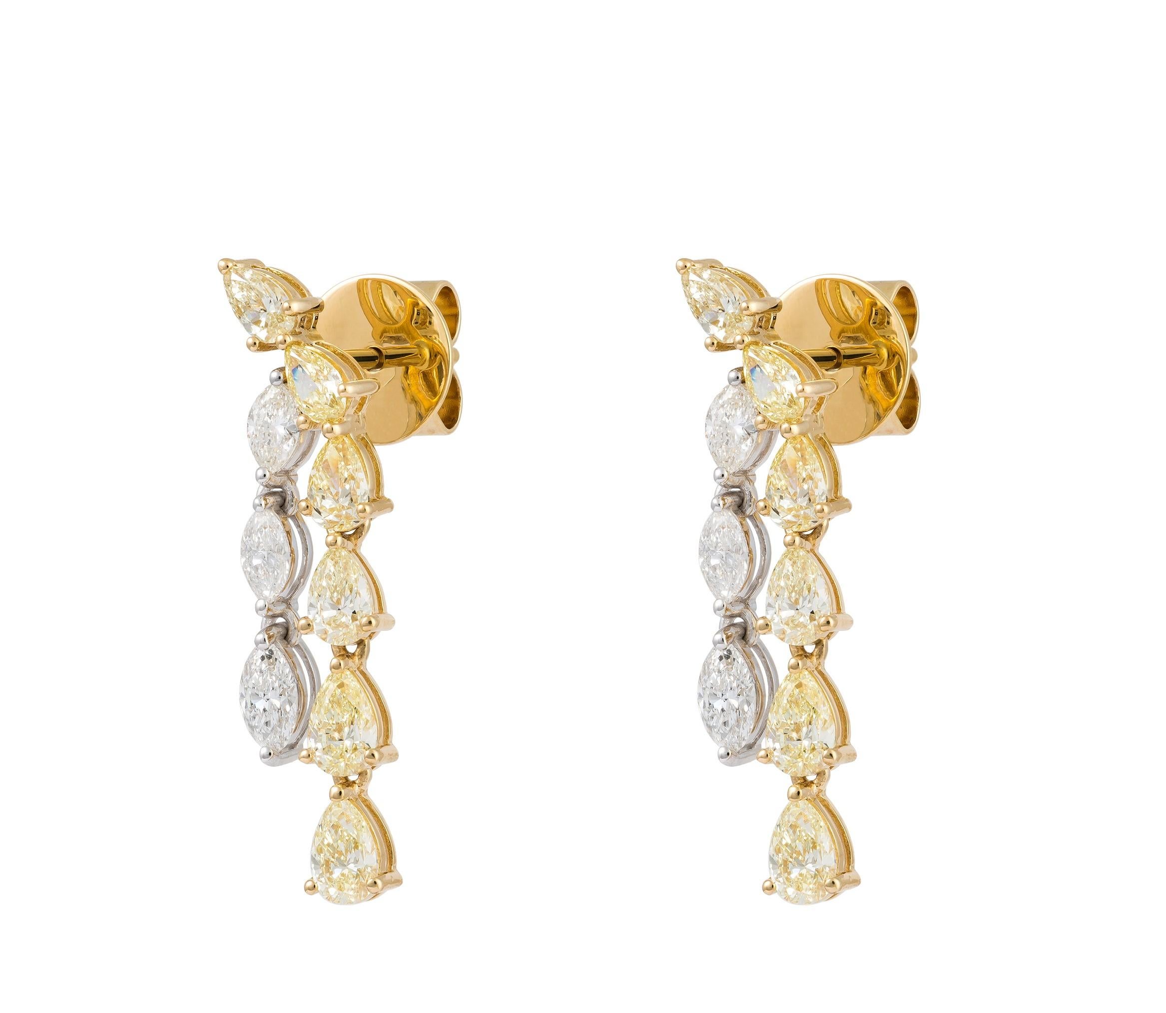The Following Item we are offering are these Extremely Rare Beautiful 18KT Gold Fine Large Light Fancy Yellow Diamond White Diamond Dangle Earrings. Each Earring features Rare Gorgeous Glittering Fancy Yellow Diamonds in 18KT Gold. T.C.W. Approx