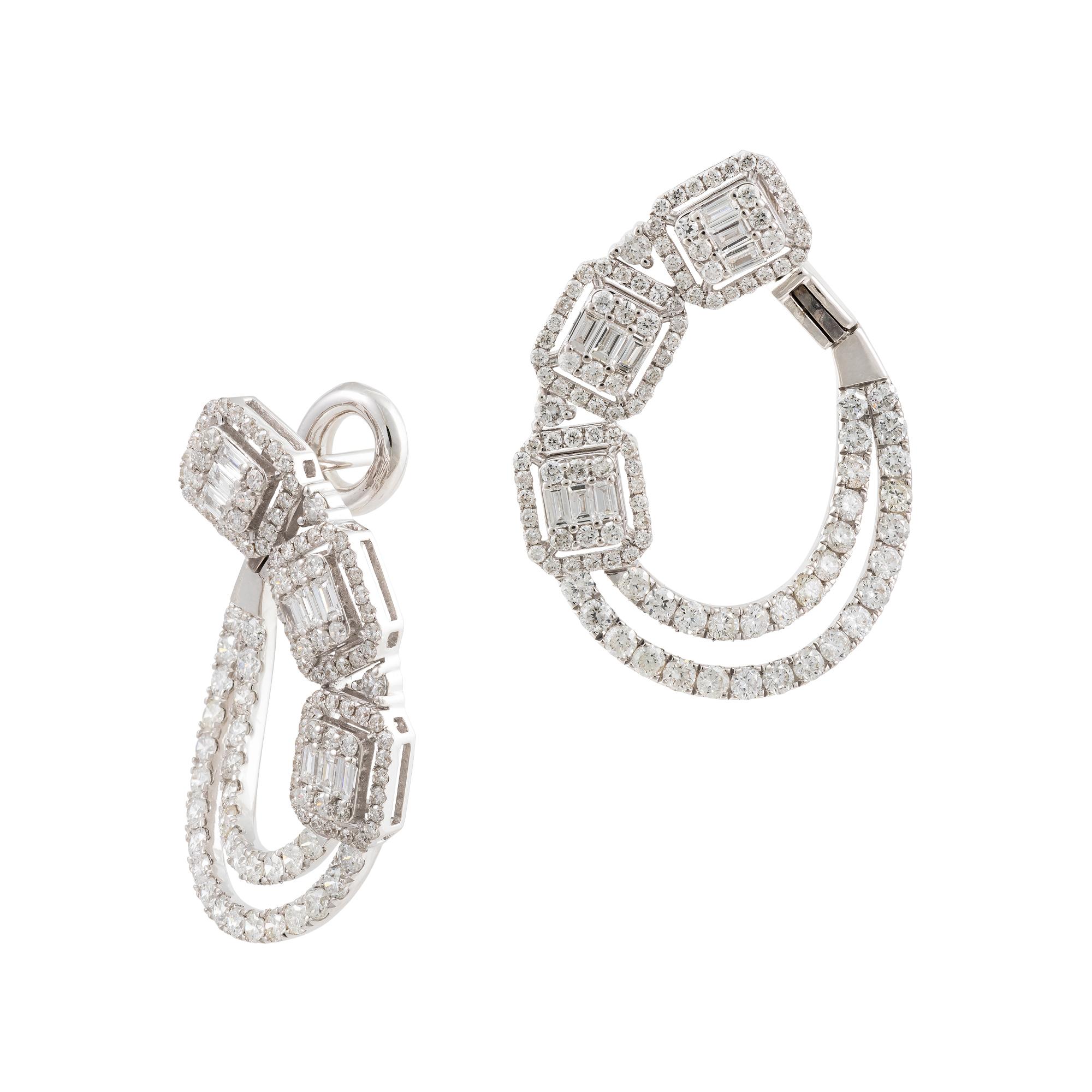 The Following Items we are offering is a Rare Important Radiant Pair of 18KT Gold Large Glistening Magnificent Large Fancy Baguette Diamond C Shape Twist Earrings. Stones are Very Clean and Extremely Fine! T.C.W. over 3CTS!!!  A near Identical Pair