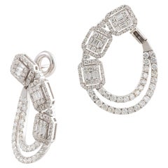 11, 500 Exquisite 18KT Gold Magnificent Triple Baguette Diamond Twist Earrings