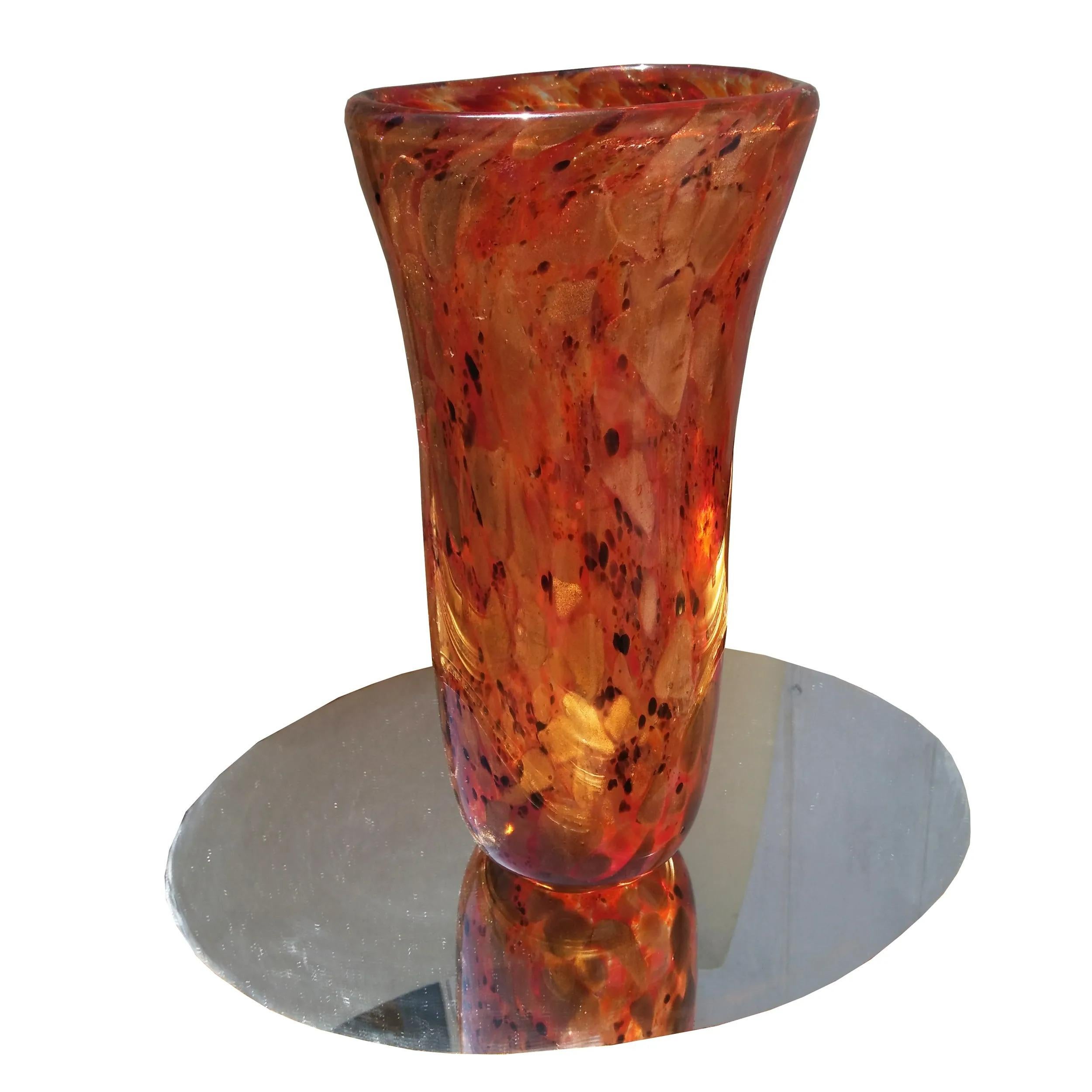 11 7/8? Amber Gold Murano Vase

Golden amber colored with black accents vase, circa 1990s Features flared top and standing approximately 12” high.