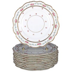 11 anciennes assiettes Cauldon anglaises en porcelaine peintes à la main:: à motifs floraux et dorées