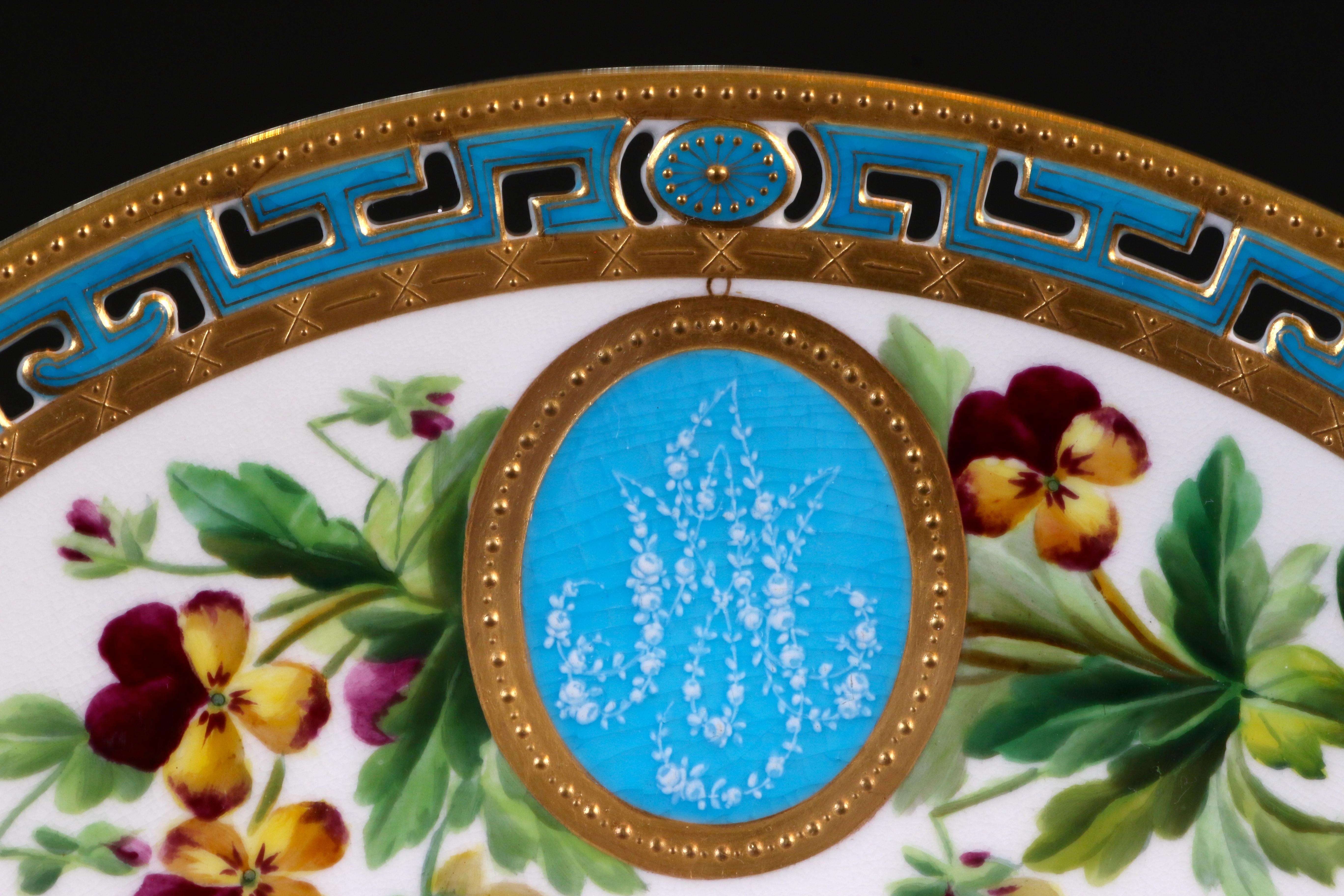 Here are 11 custom, monogrammed, hand painted pate-sur-pate cabinet or dinner plates from Minton, Stoke-on-Trent, England. The top of each plate is decorated with a unique spray of hand-painted flowers that surrounds a bleu celeste 