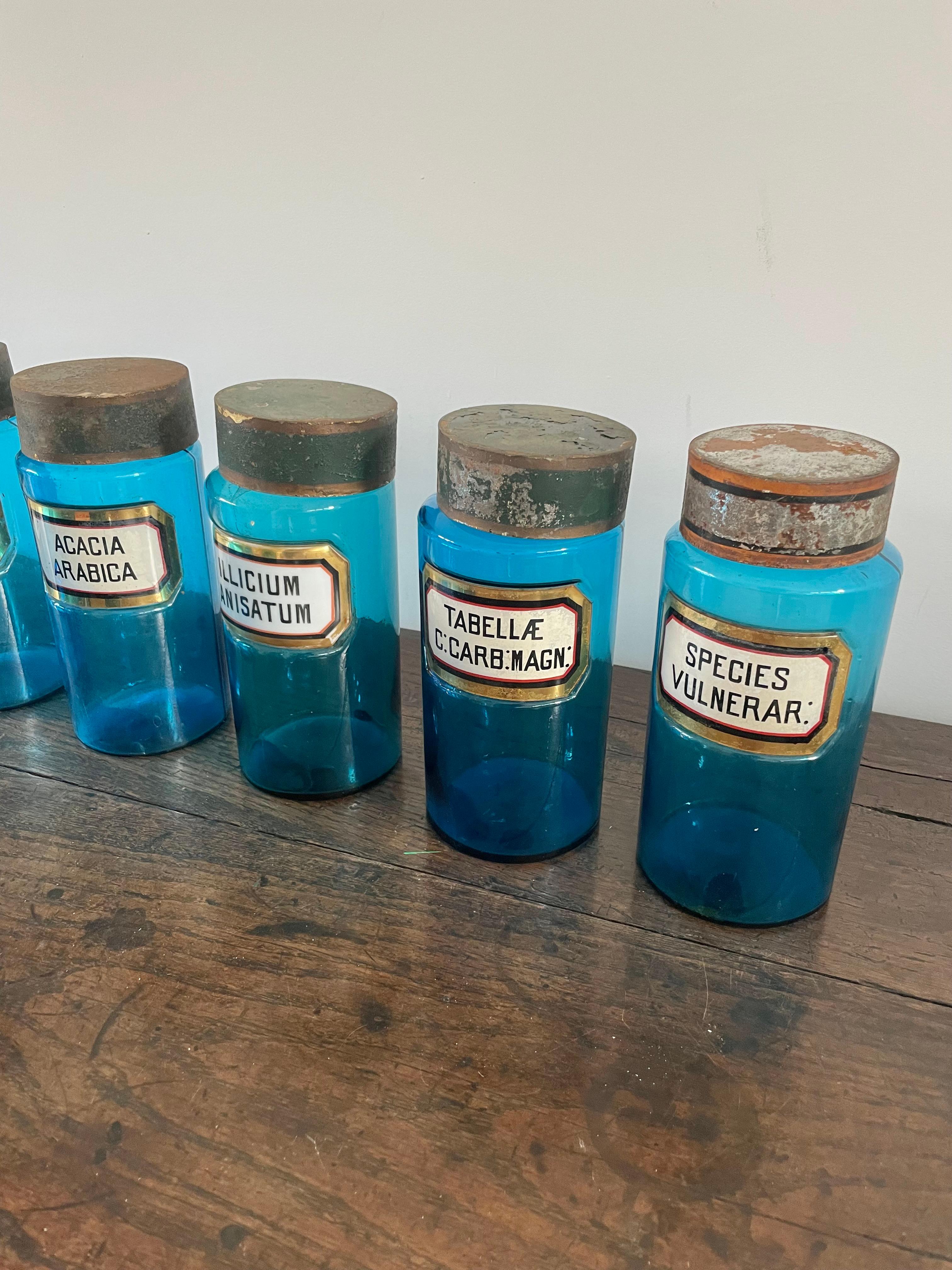 20th Century 11 blue glass apothecary bottles