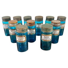 11 blue glass apothecary bottles