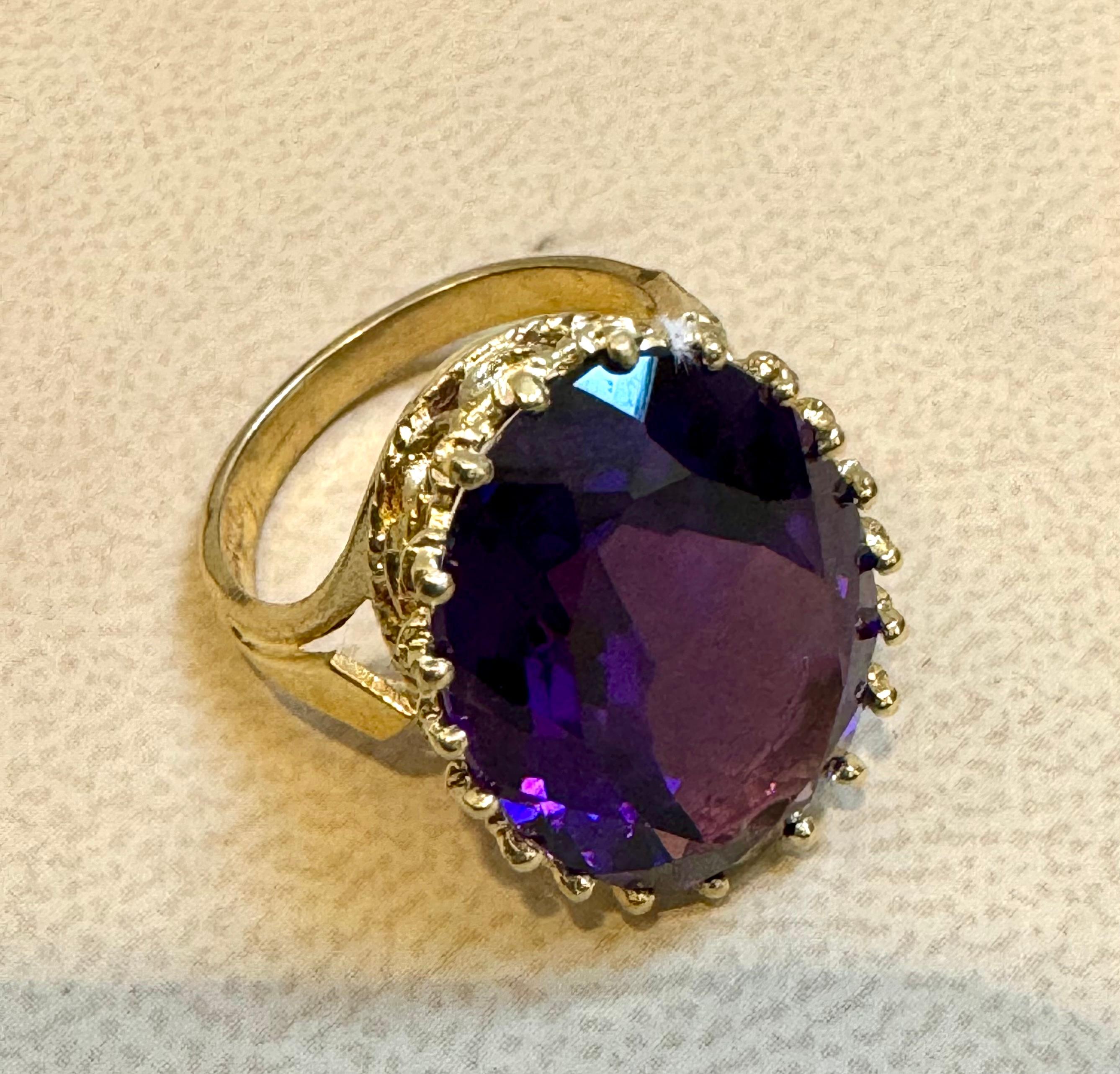 Approximately 11 Carat Beautiful  Amethyst Cocktail Ring in 14 Karat Yellow Gold Size 5.25
This is a Beautiful Cocktail ring ring which has a large approximately 14  carat of high quality Amethyst . Color and clarity is extremely nice. Large Oval