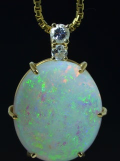 11 Carat Australian Opal Pendant in 14 Karat Yellow Gold Set with Diamonds