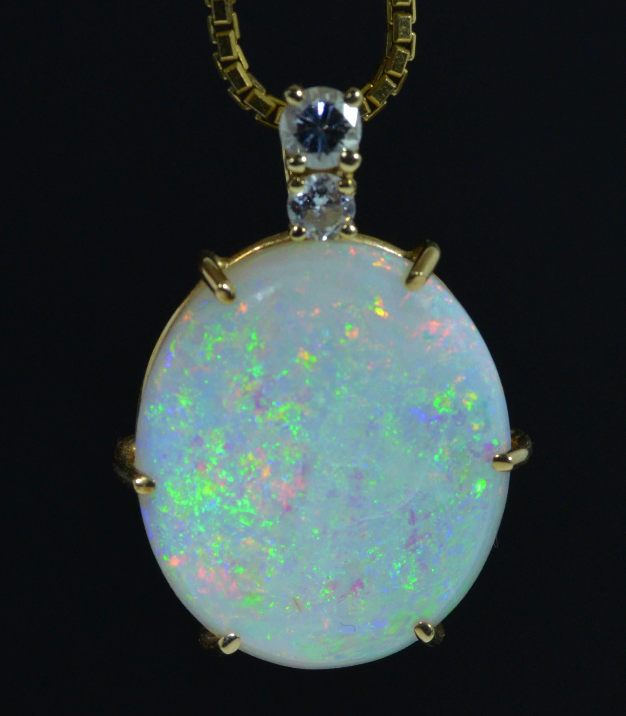 Oval Cut 11 Carat Australian Opal Pendant in 14 Karat Yellow Gold Set with Diamonds For Sale