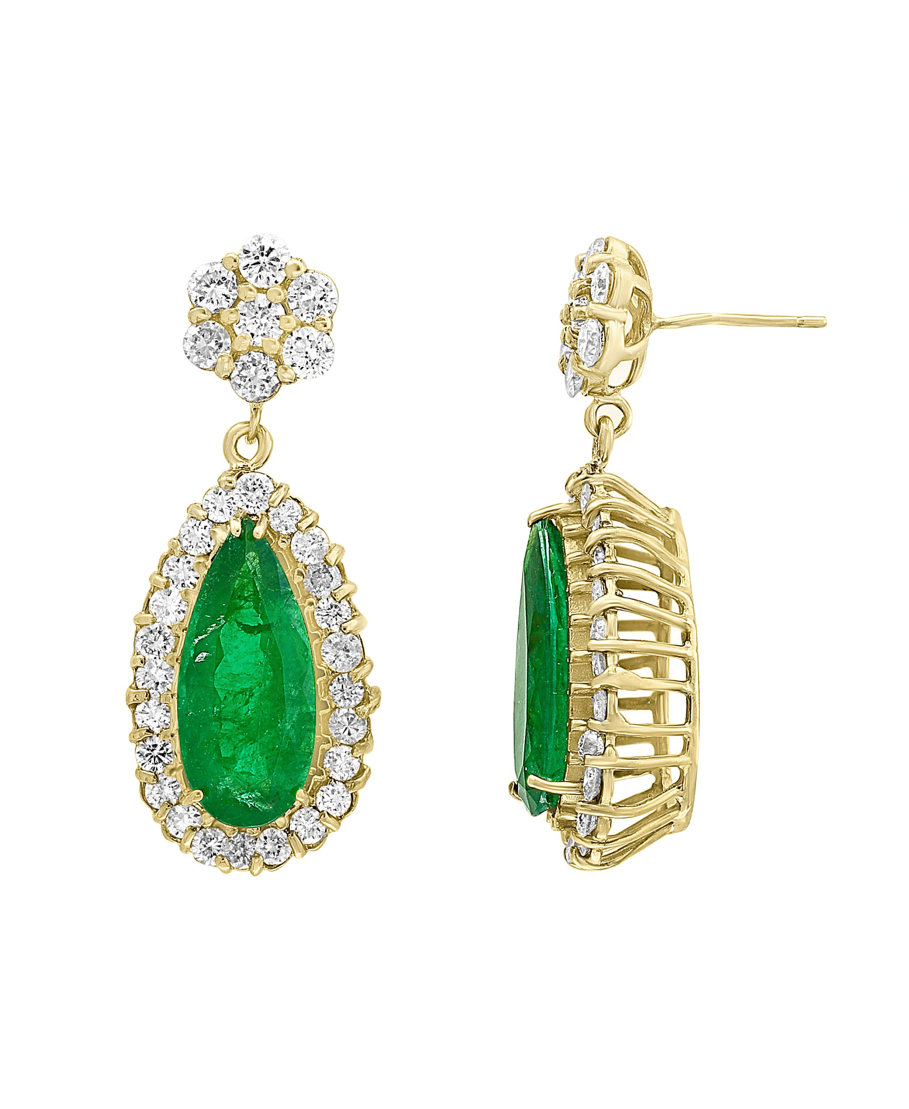 
11 Carat Colombian Pear Shape Emerald Diamond  Hanging Earrings 14 K Yellow Gold
This exquisite pair of earrings are beautifully crafted with 14 karat Yellow gold  weighing    
 14 grams
Two fine Natural  Colombian Pear Shape Emeralds weighing