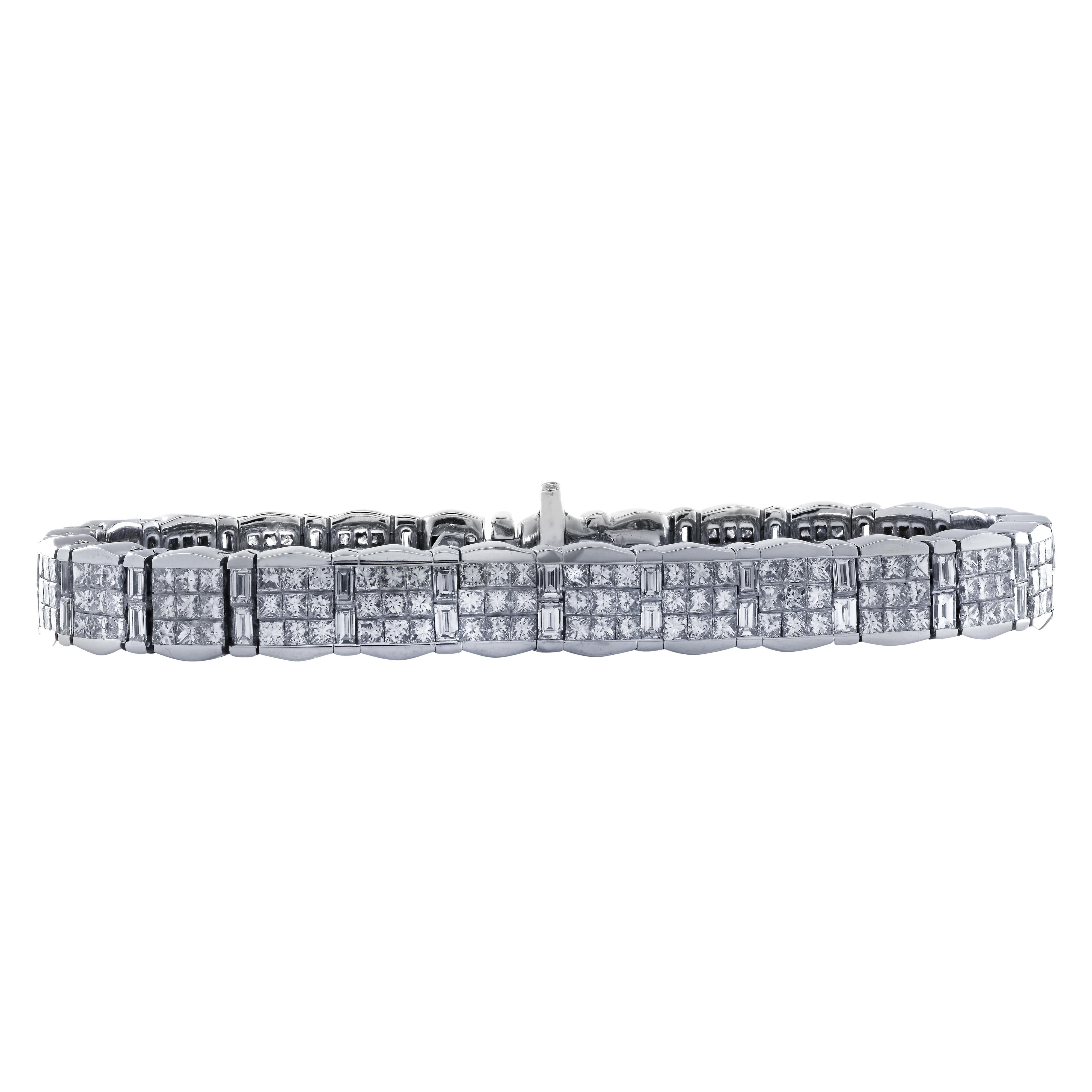 Spectacular bracelet crafted in 18 karat white gold featuring 275 princess and baguette cut diamonds weighing approximately 11 carats total, G color, VS clarity. 25 square links, each set with 9 princess cut diamonds interspersed with 25 links each