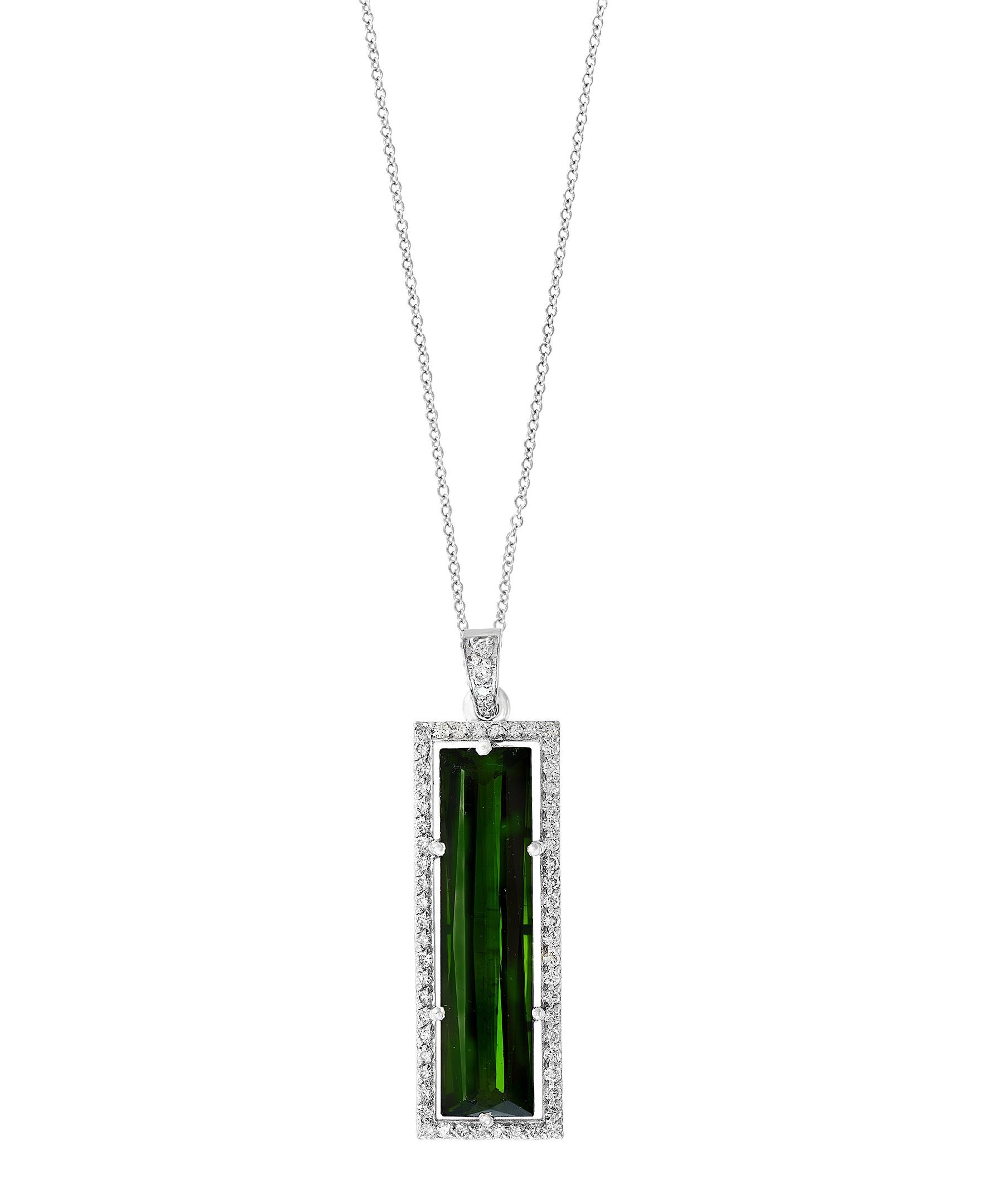   11.5  Carat Green Tourmaline  & Diamond Pendant /  Necklace 18 Karat  Gold.
This spectacular Pendant Necklace  consisting of a single long Cushion  Shape Green Tourmaline Approximately  11.5 Carat.  The  Green Tourmaline  is surrounded by