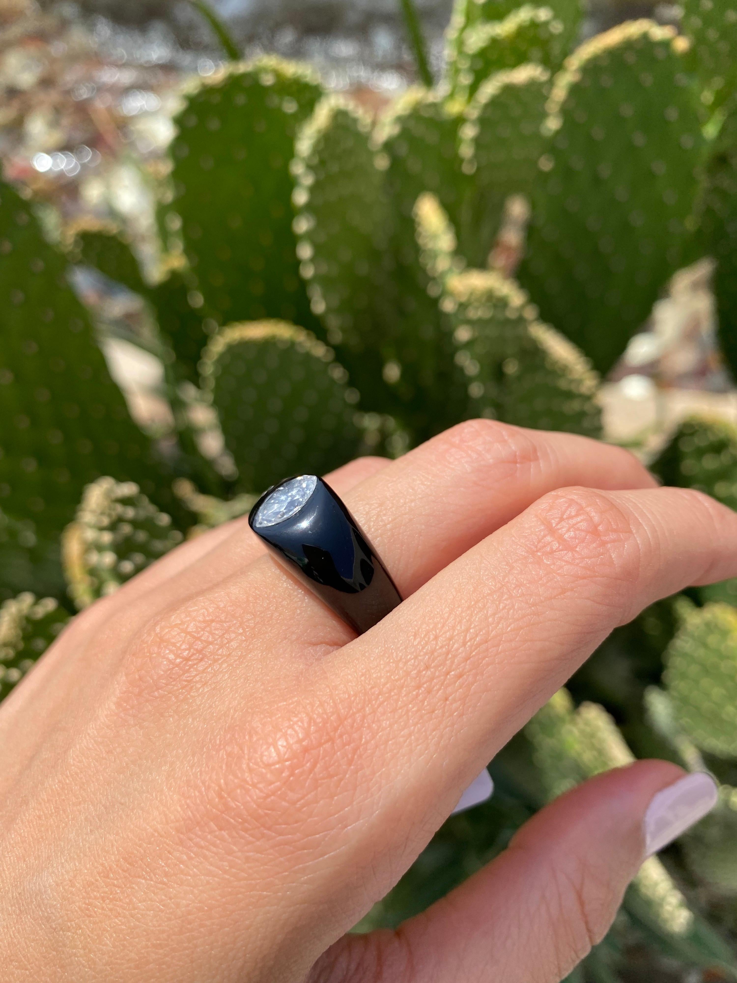 An art-deco inspired, statement 1.1 carat marquise shaped White Diamond, set in a custom cut Black Onyx ring - currently sized at US 6.5, can be customized and remade according to ring size. 
We provide free shipping, and we accept returns! 
Message
