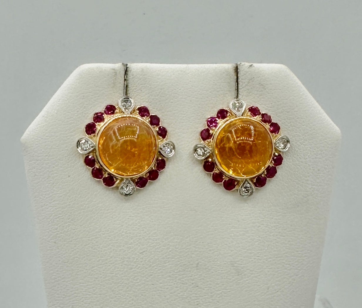 This is a spectacular pair of antique Retro - Art Deco 11 Carat Mexican Fire Opal, Ruby and Diamond Earrings in 14 Karat Gold.  The sparkling round Mexican Fire Opals are each approximately 5.75 Carats for a total weight of approximately 11 Carats. 