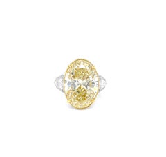 11 Carat Oval Yellow Diamond, Engagement Three Stones Halo Ring, GIA Certified.
