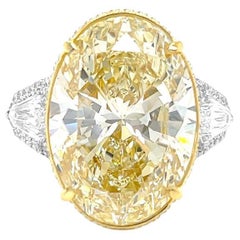 11 Carat Oval Yellow Diamond, Engagement Three Stones Halo Ring, GIA Certified.