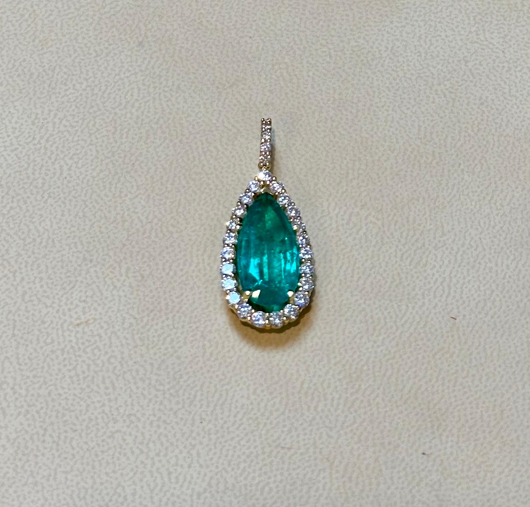 Introducing our extraordinary pendant necklace enhancer featuring an approximately 11 carat pear-shaped Colombian Emerald and a dazzling array of diamonds. This necklace is truly a sight to behold, showcasing the exquisite beauty of the emerald and