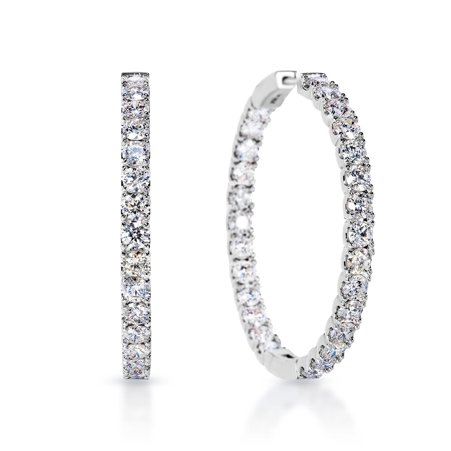Looking for a pair of stunning diamond earrings? Look no further than these earth-mined diamond earrings, featuring 10.84 carats of bright and brilliant round brilliant cut diamonds set in beautiful 14-karat white gold. With their dazzling sparkle
