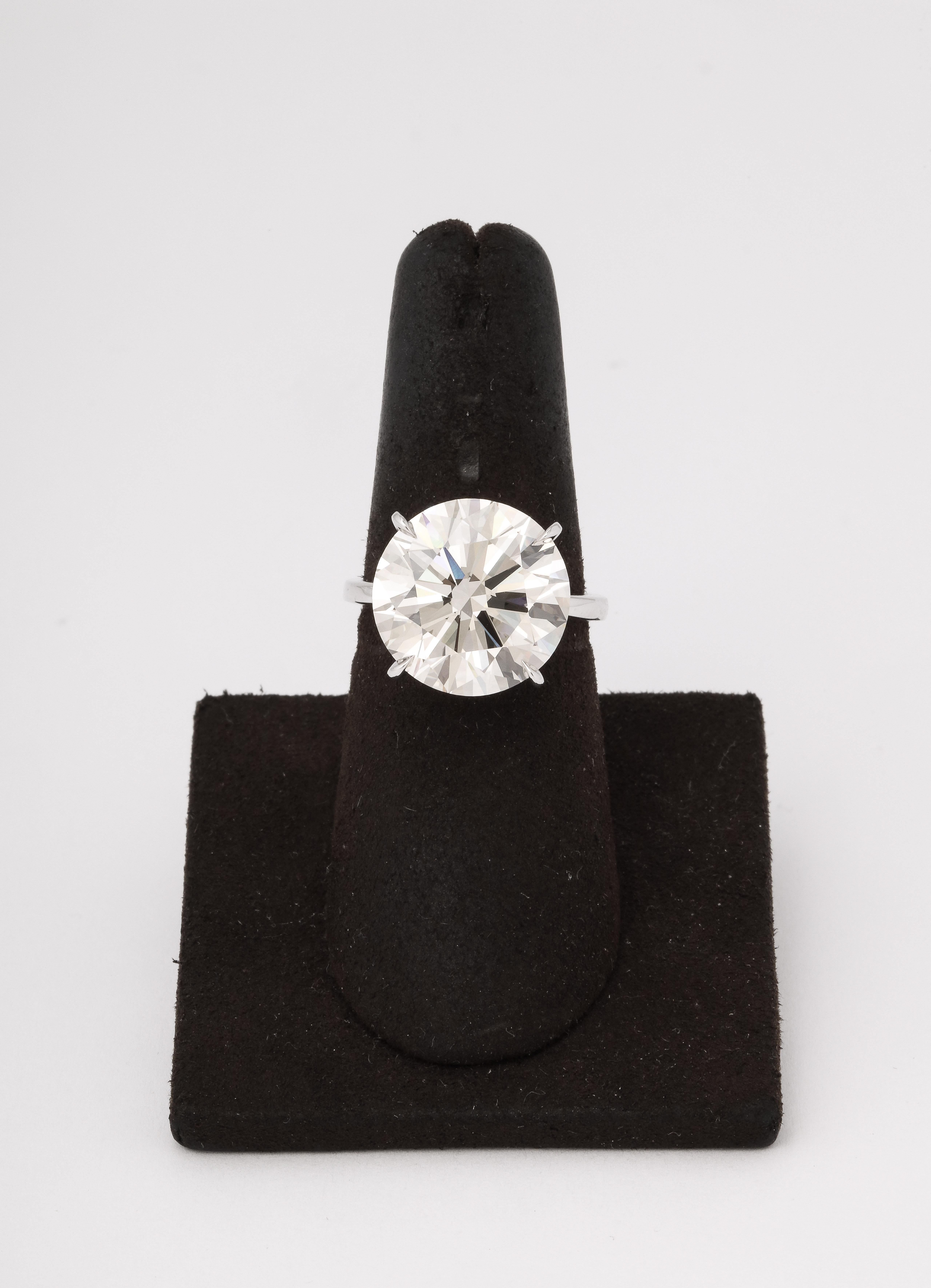 
An AMAZING ROCK! 

GIA certified 11.07 carat Round Brilliant cut diamond. Set in a 4 prong custom made platinum mounting. 

The diamond faces up as a near colorless white stone. 

The diamond is VVS1 clarity and “triple excellent” Excellent Cut,