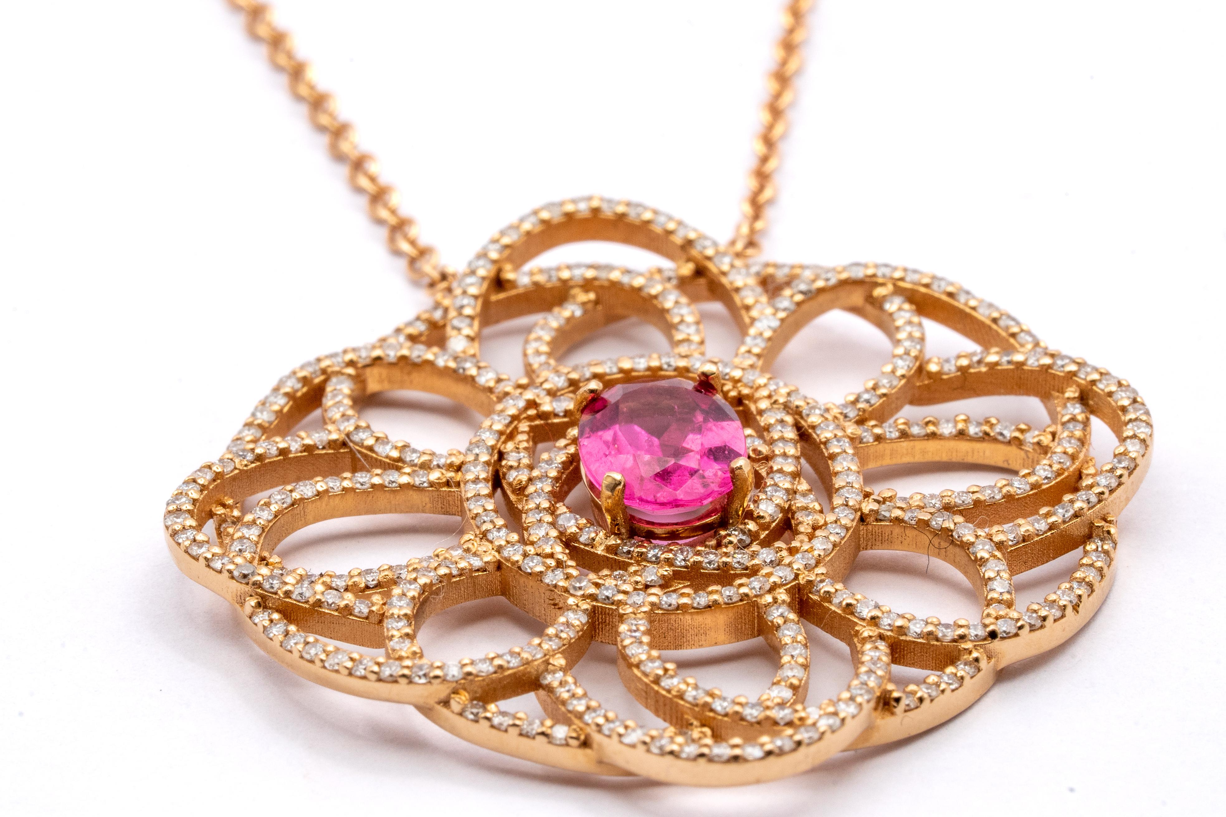 This beautiful pendant made of 18 carat rose gold for 9.12 grams boasts a central rubelite of 1.1 carat and 332 VS G color diamonds for a total of 1.7 carats. the lenght of the necklace is 42 centimeters
any item of our jewelry collection has a