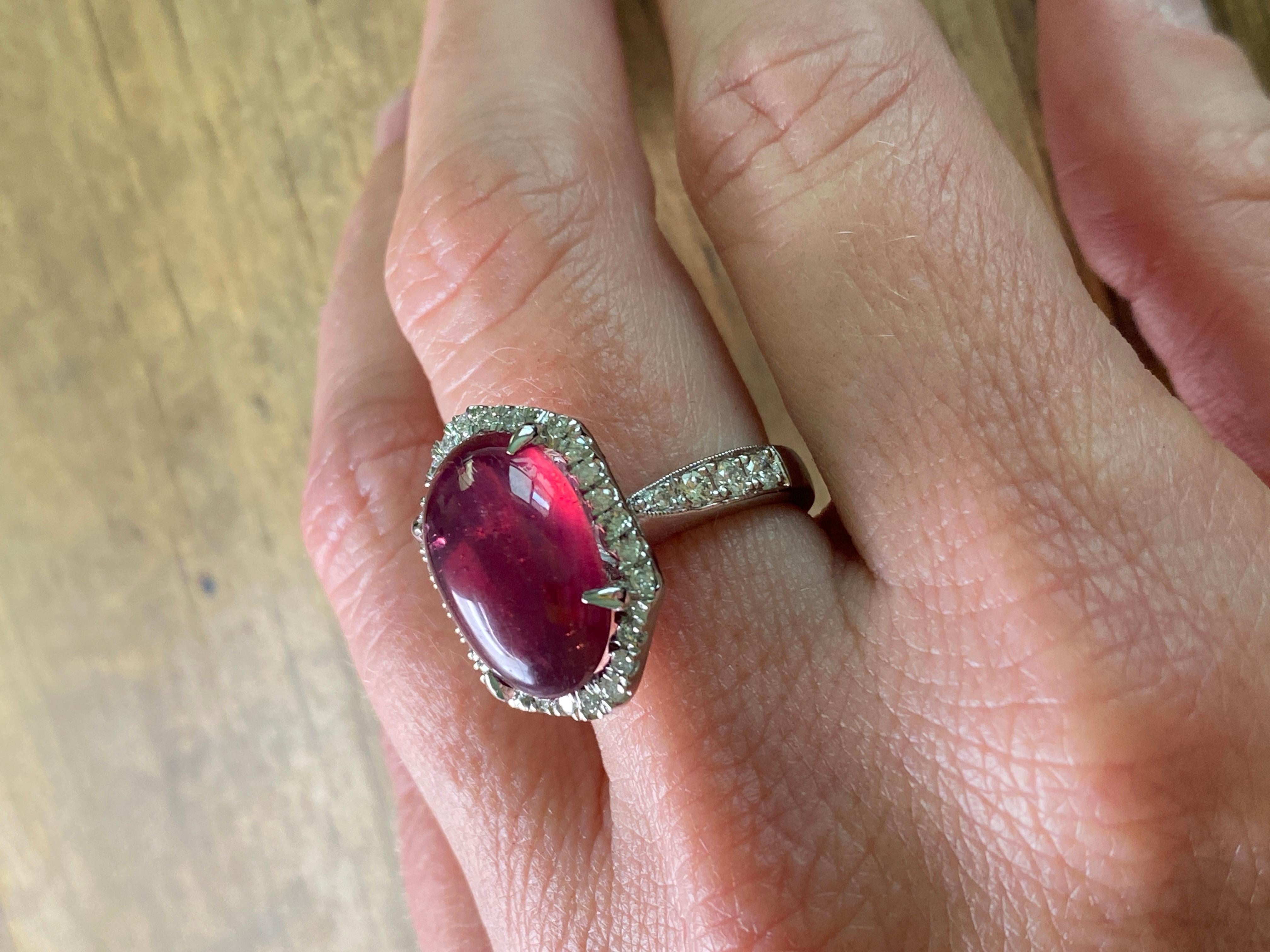 11 Carat Ruby Cabochon, Dome, with Diamonds, Cocktail Ring
Size 6 1/4
Stunning dark pink ruby with minor inclusions. Diamonds are channel set all around and on band.
Sure to be a stunner day or night. 