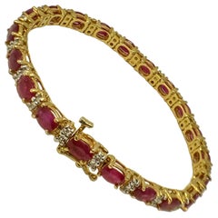 Bracelet jonc en or jaune et rubis de 11 carats