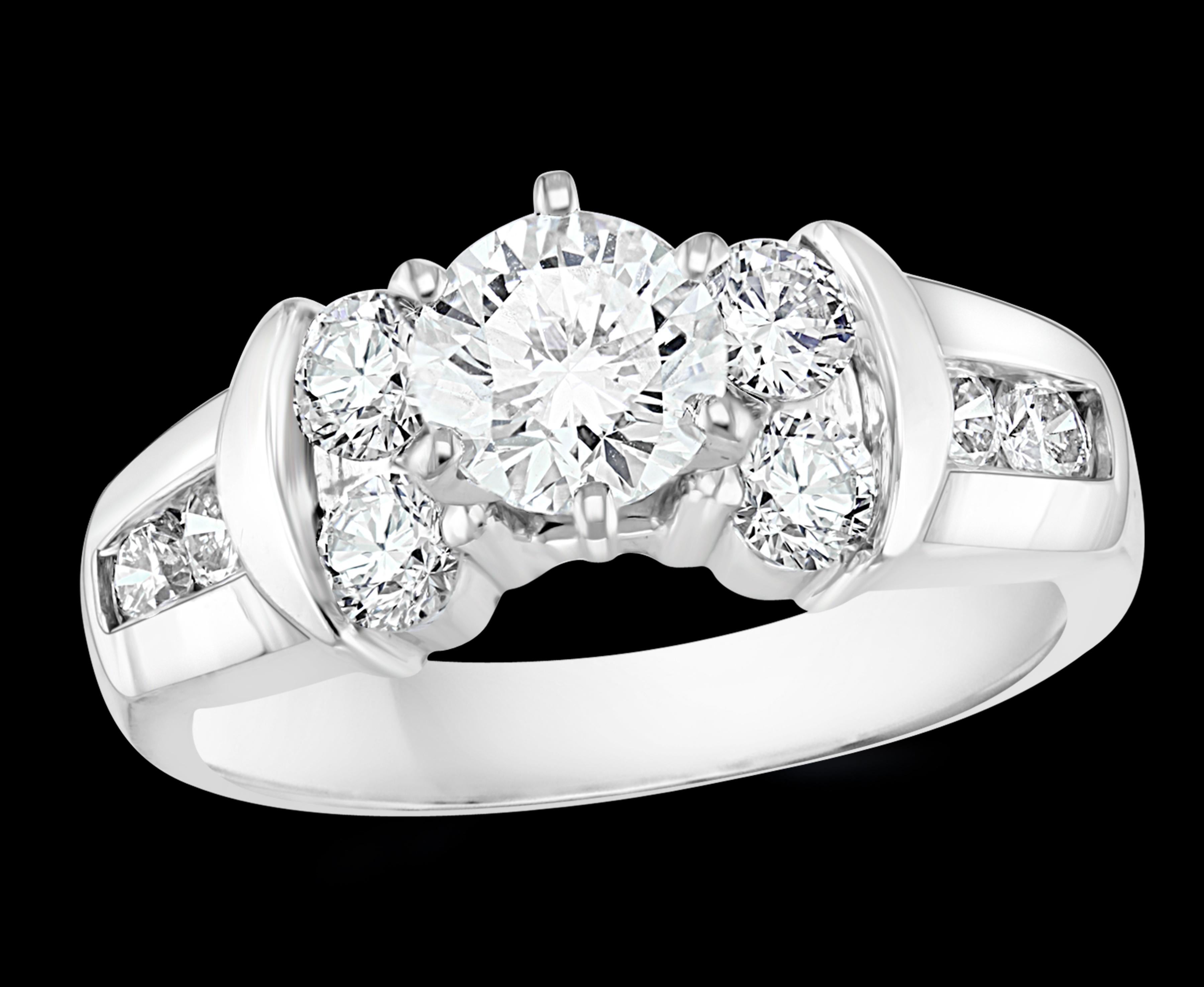 1.1 Carat Solitaire Round Shape 2.0 Total Diamond Engagement 14 White Gold Ring
Prong set
14 K gold Stamped 8.3 Grams
Diamond VS quality and G/H color.
Side diamonds are also round diamonds which weigh approximately 0.9 ct
Total Diamond Weight  2.0 