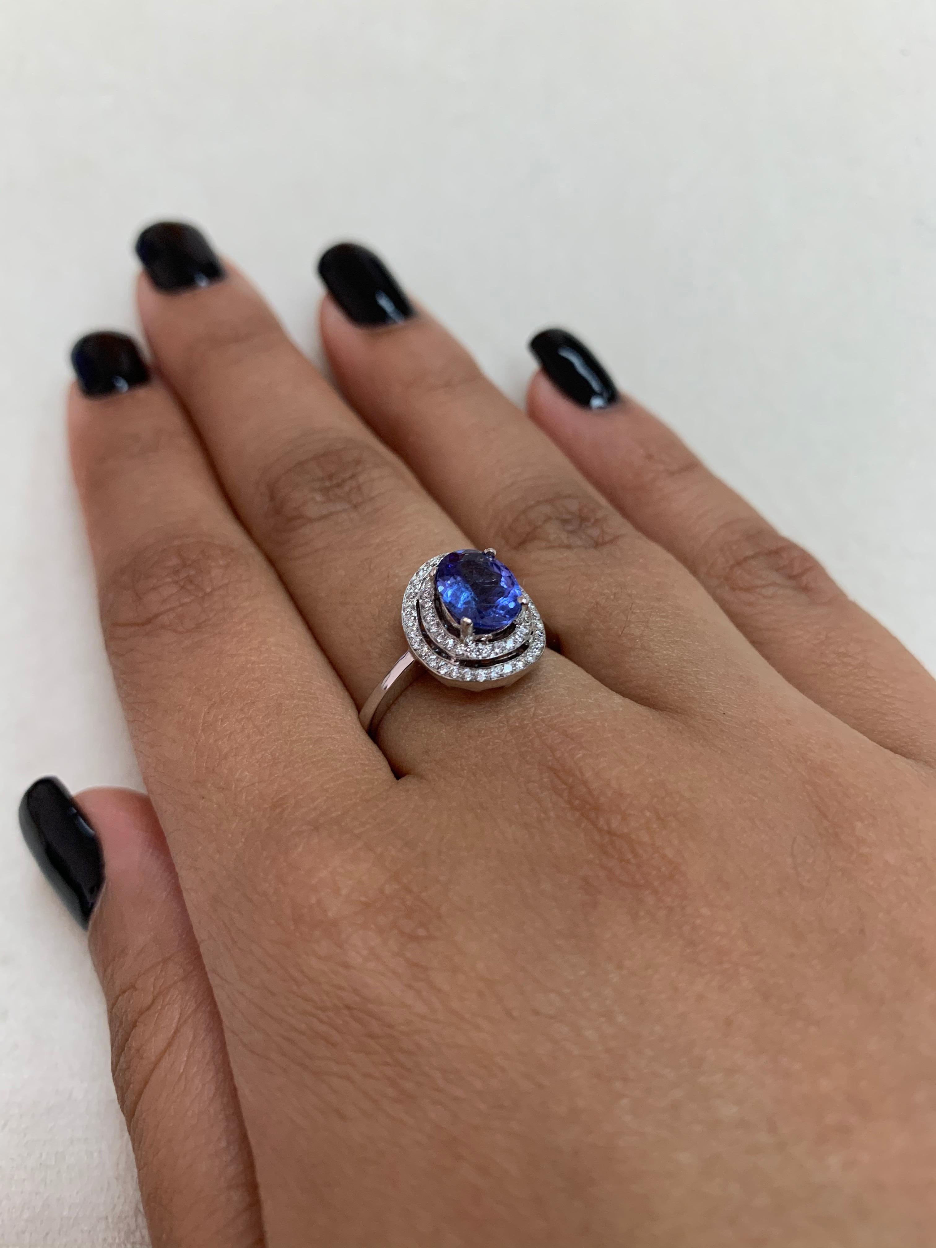 Oval Cut Sunita Nahata Tanzanite 1.10ct. Fancy Ring in 18K White Gold with Diamond. For Sale