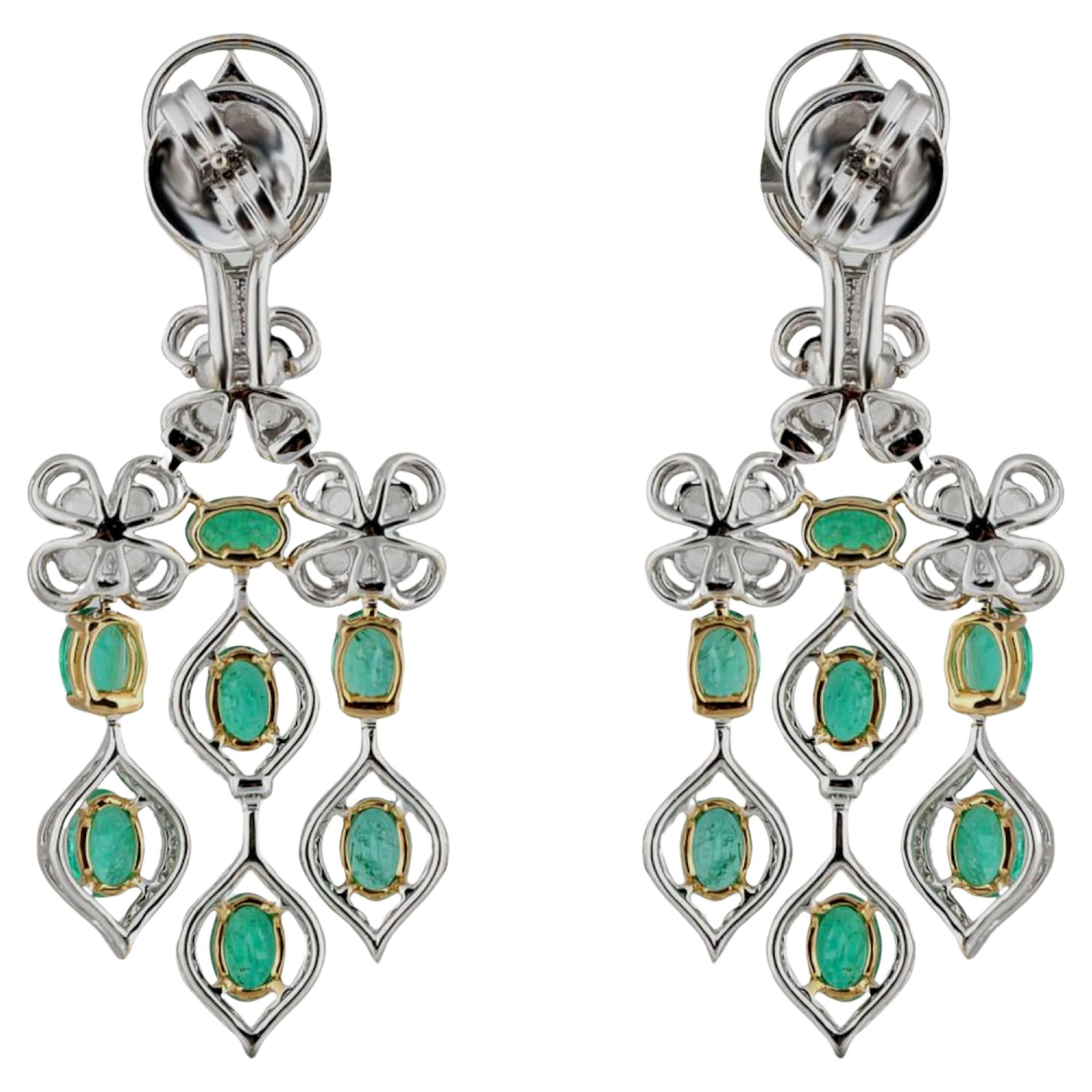 18K white and yellow gold, adorned with a total of 358 handpicked diamonds and emeralds. The use of round rose cut and round brilliant cut stones adds a touch of elegance and sophistication. The reference to a matching necklace suggests a