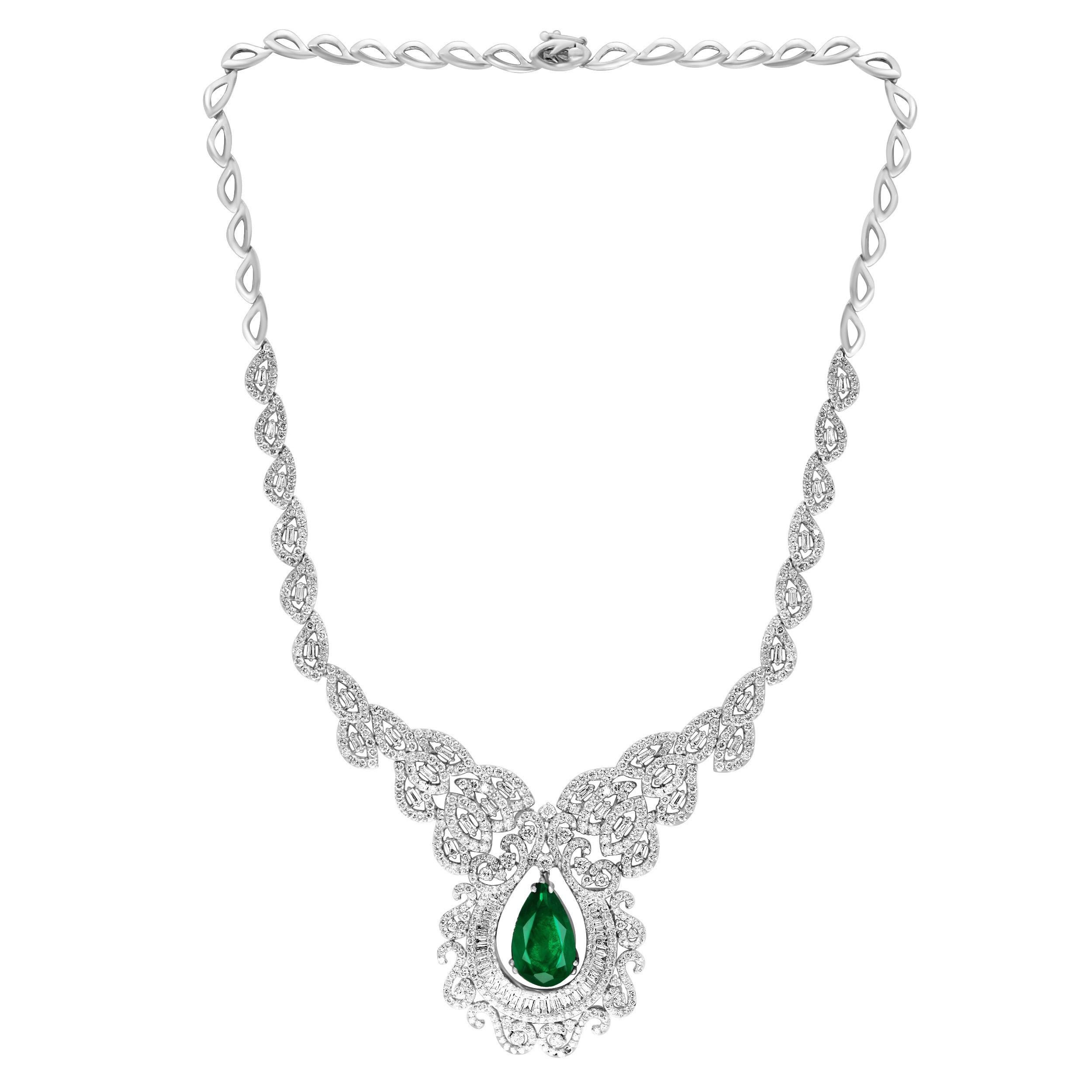 Approximately 11 Ct Pear Shape Zambian Natural Emerald & approximately  17 Ct Diamond Necklace 18 Karat  White Gold
This spectacular Bridal set  consisting of 1 large  Pear shape  Emerald approximately 11 to 12 ct in size
There are  approximately 17