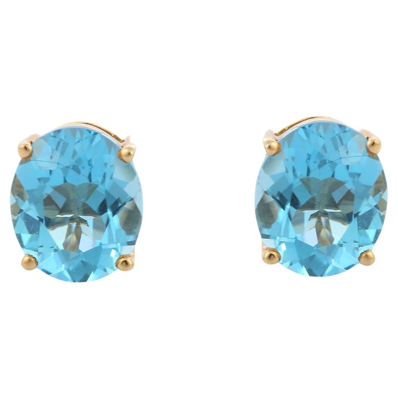 11 Ct Oval Cut Prong Set Blue Topaz Stud Earrings in 10K Yellow Gold  For Sale