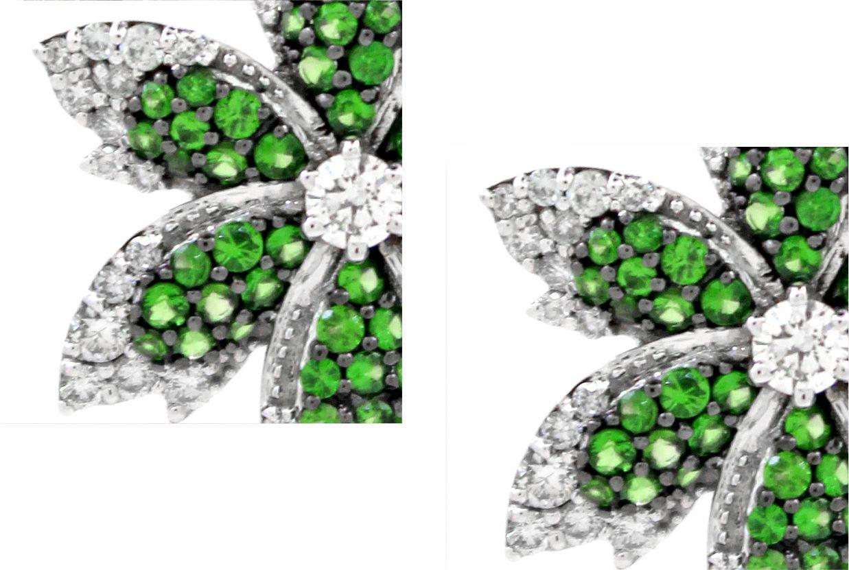 Ti presentiamo i nostri squisiti orecchini a perno ispirati ai fiori, una splendida incarnazione dell'eleganza e del design intricato della natura. Questi splendidi orecchini presentano 104 tsavoriti a taglio rotondo per un totale di 1,1 carati,