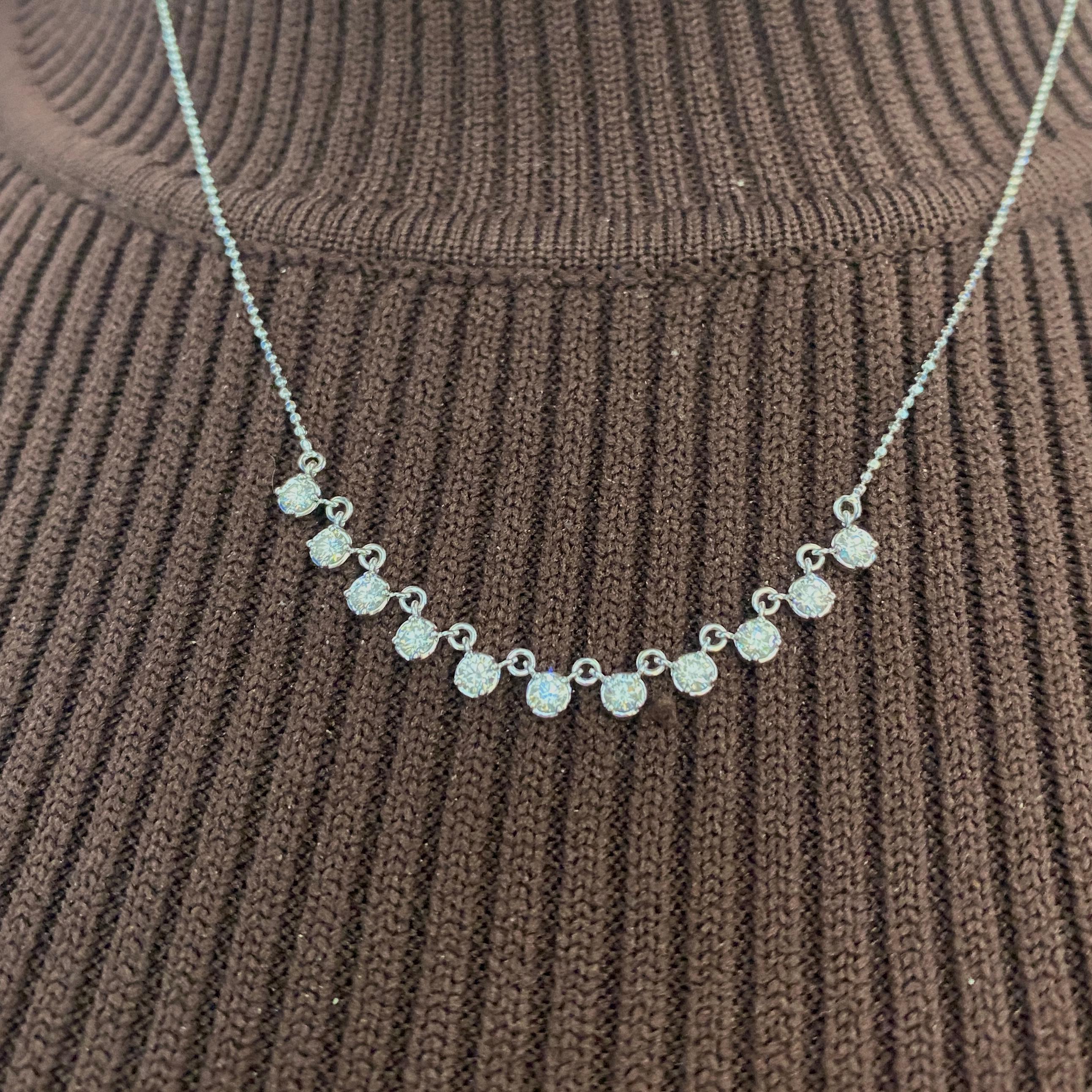 This is a fabulous contemporary diamond tennis necklace design, sure to compliment any wardrobe! Each diamond is set with four prongs on a seat that makes it look like a bezel set diamond. These diamonds sparkle brilliantly in their seats and make
