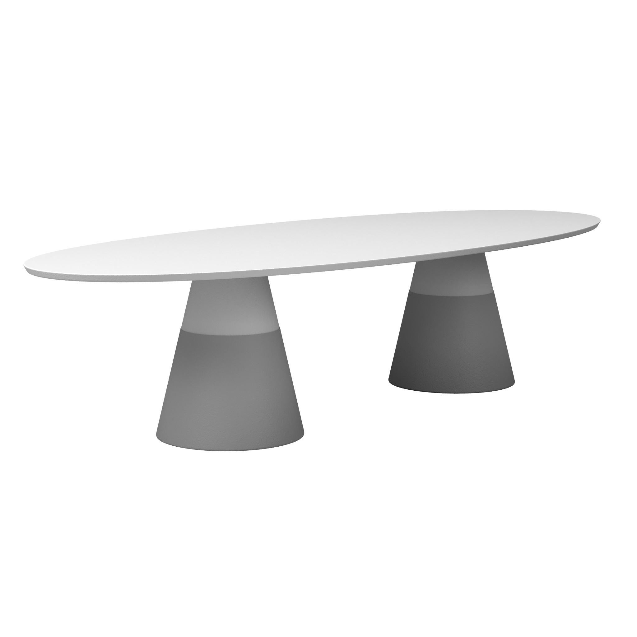 Contemporary outdoor dining table crafted of fiber reinforced resin. This highly resistant material is very durable and requires less maintenance than concrete. The table top is lacquered in matte white while the conical bases are accentuated with