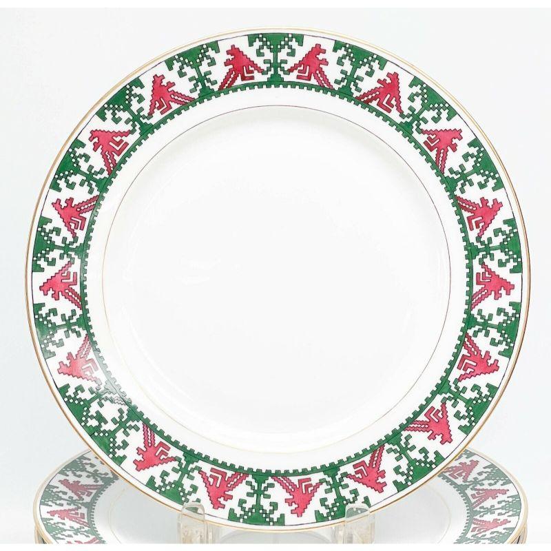11 Kornilov Bros Imperial Russian porcelain dinner plates red & green, c. 1910

11 Kornilov Bros Imperial Russian porcelain dinner plates in pattern N8, circa 1910. A white ground with red and green geometric patterns to the edge. Gilt to the rim.