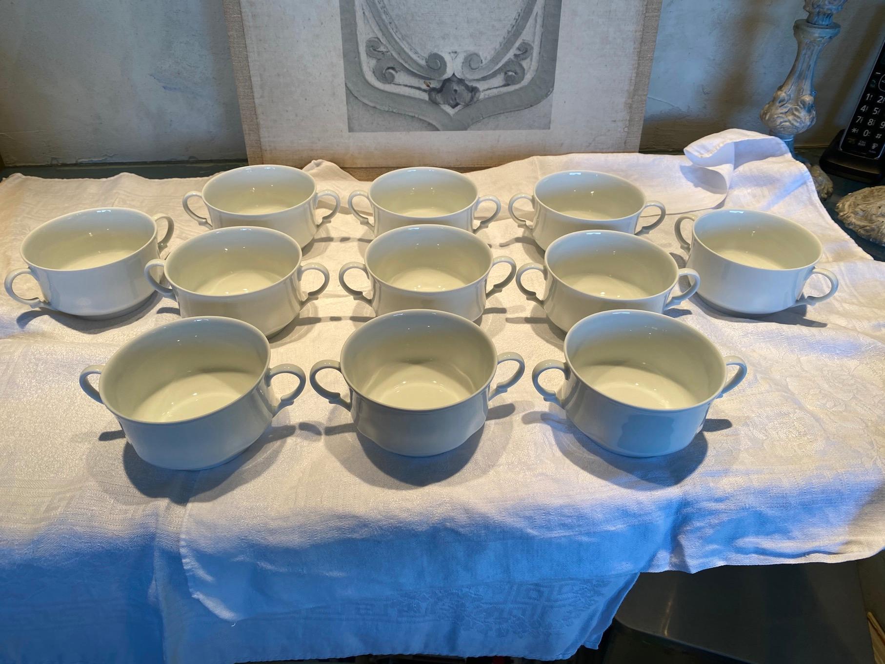 Fine bone china by Limoges of France. White consommé or soup cup with handles will bring elegance to any setting. Cup measures: 4