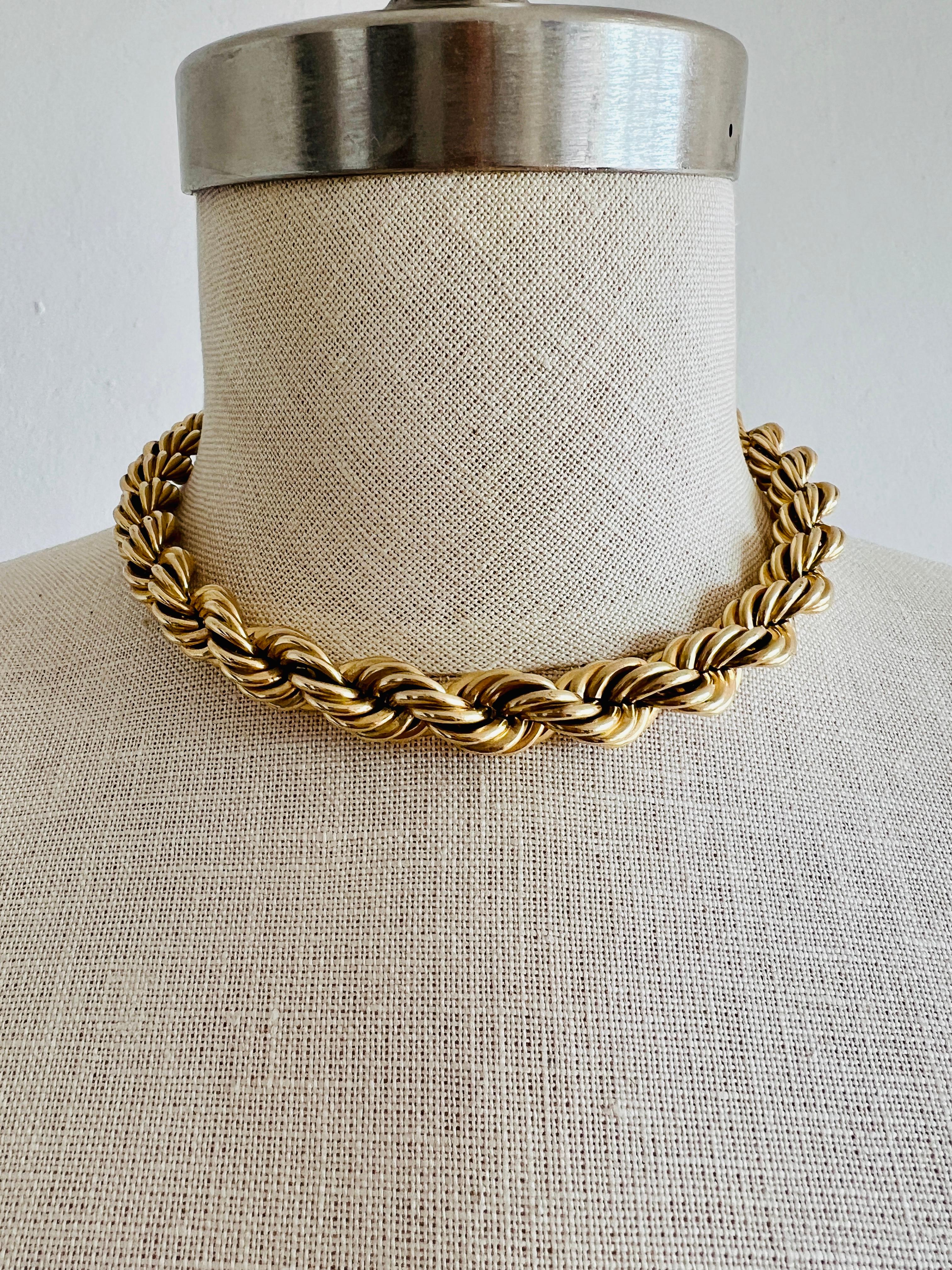 Versatile thick rope chain necklace that can be worn as a choker necklace or doubled into a bracelet, both creating a statement!

Length: The rope chain is 15-1/2 in long by 11 mm wide. 
Weight: 39.8 grams. The heft is light weight for its