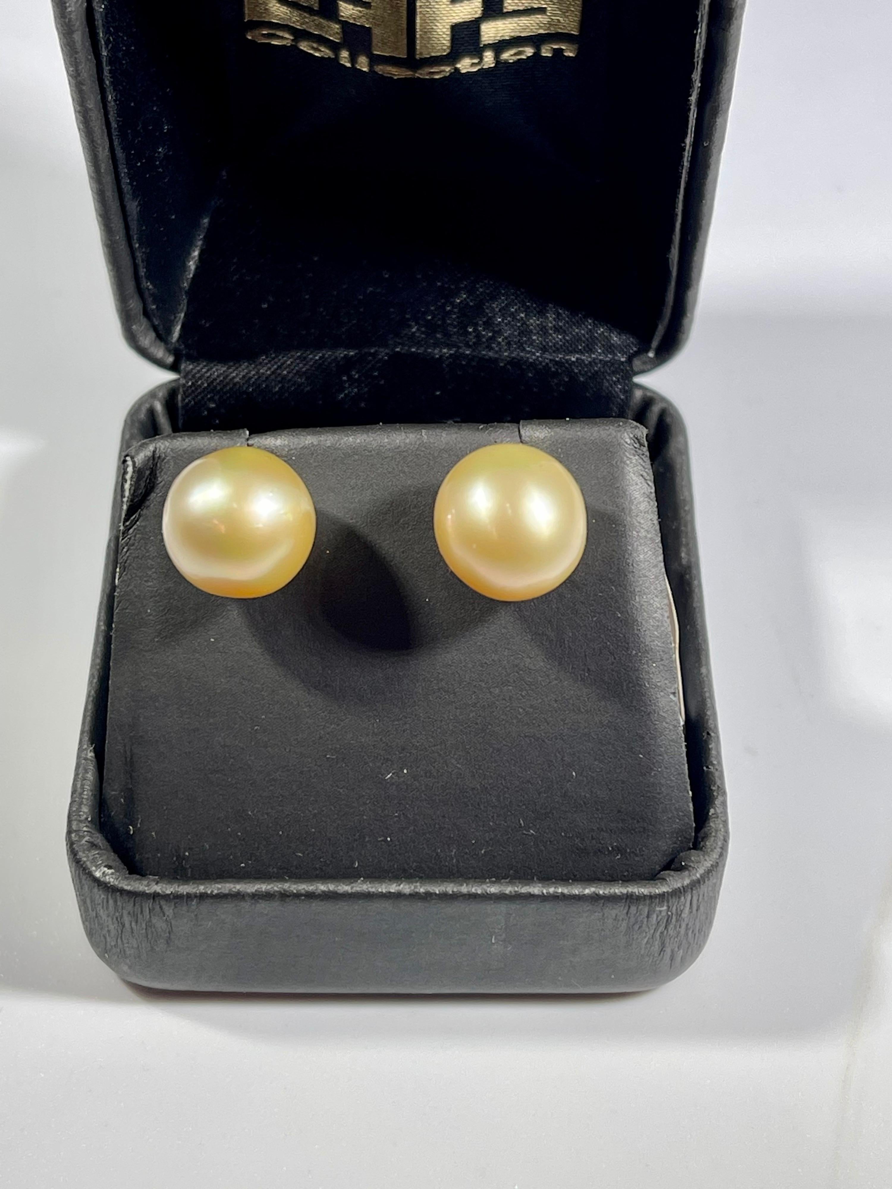 11 MM Golden South Sea Pearl Stud Earrings 18 Karat Yellow Gold 
 pearls are  clean but have some scratch or  blemishes .
Light golden in color
perfect pair made in 18 Karat Yellow gold
backs are made of solid 18 k gold and very sturdy to keep the