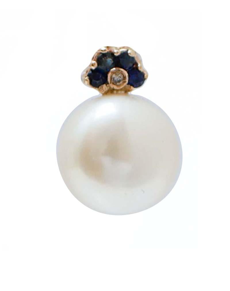 Fantastic earrings in 14 kt rose gold structure mounted, in the upper part, with blue sapphires and a little diamonds. As pendant, a  pearl.
Diamonds 0.02 ct
Blue Sapphires 0.38 ct
Pearls 3.90 gr
Total Weight 4.70 gr
RF +IHC

For any information,