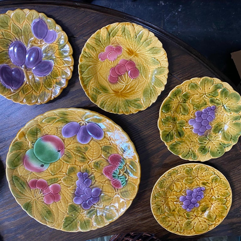 Set of Sarreguemines French Faience Majolica dessert plates, with a variety of fruit on a background of overlapping leaves.

Glazed by hand, each plate stamped

2 strawberry, 1 plum, 1 cherry, 2 grape, 2 pears and 2 apples

1 serving platter
