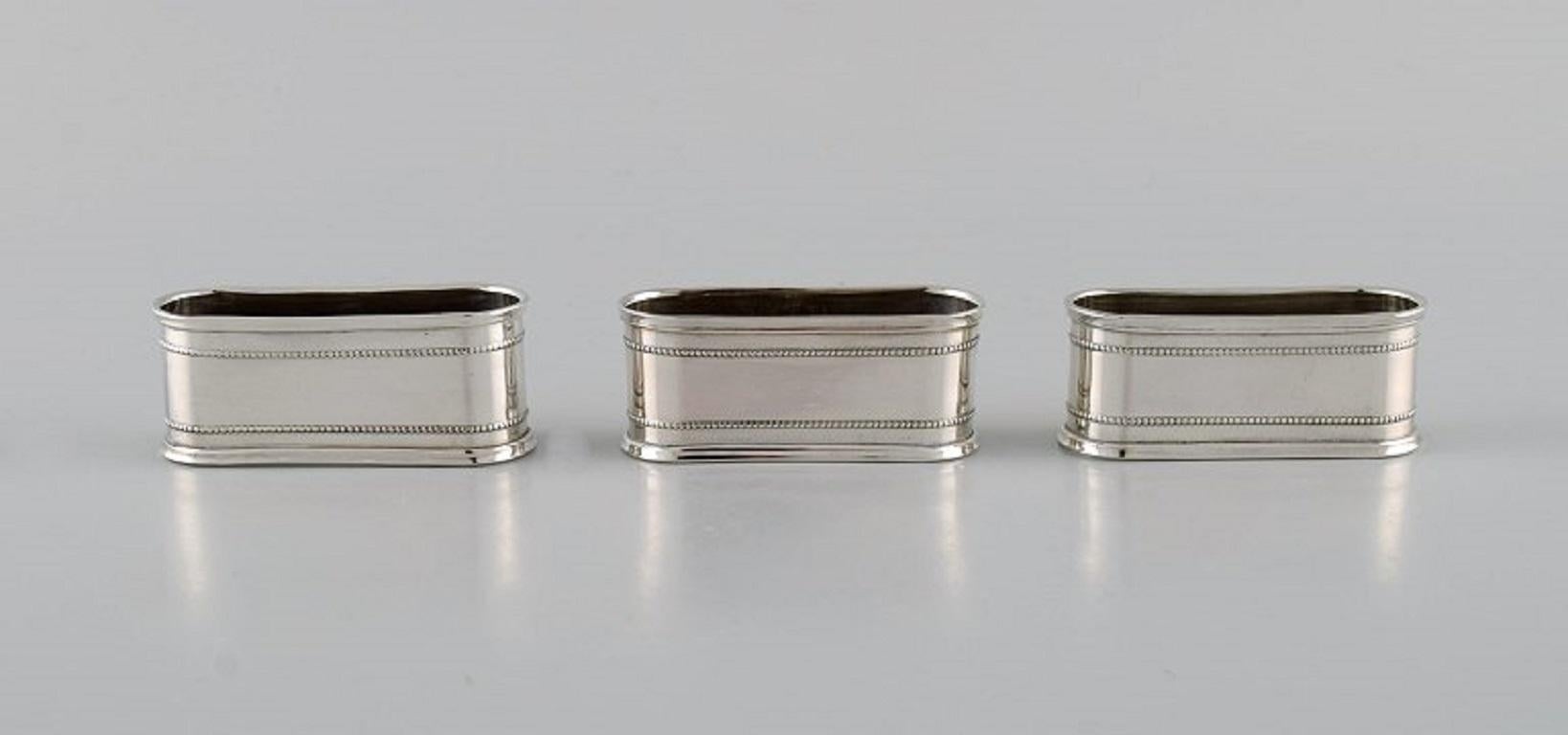 11 Sener napkin rings in silver 900, with beaded border. 
Turkey, 1930s / 40s.
Measures: 6.3 x 2.5 x 2.5 cm.
In excellent condition.
Stamped.
Our skilled Georg Jensen silversmith can polish all silver and gold so that it appears new. The price
