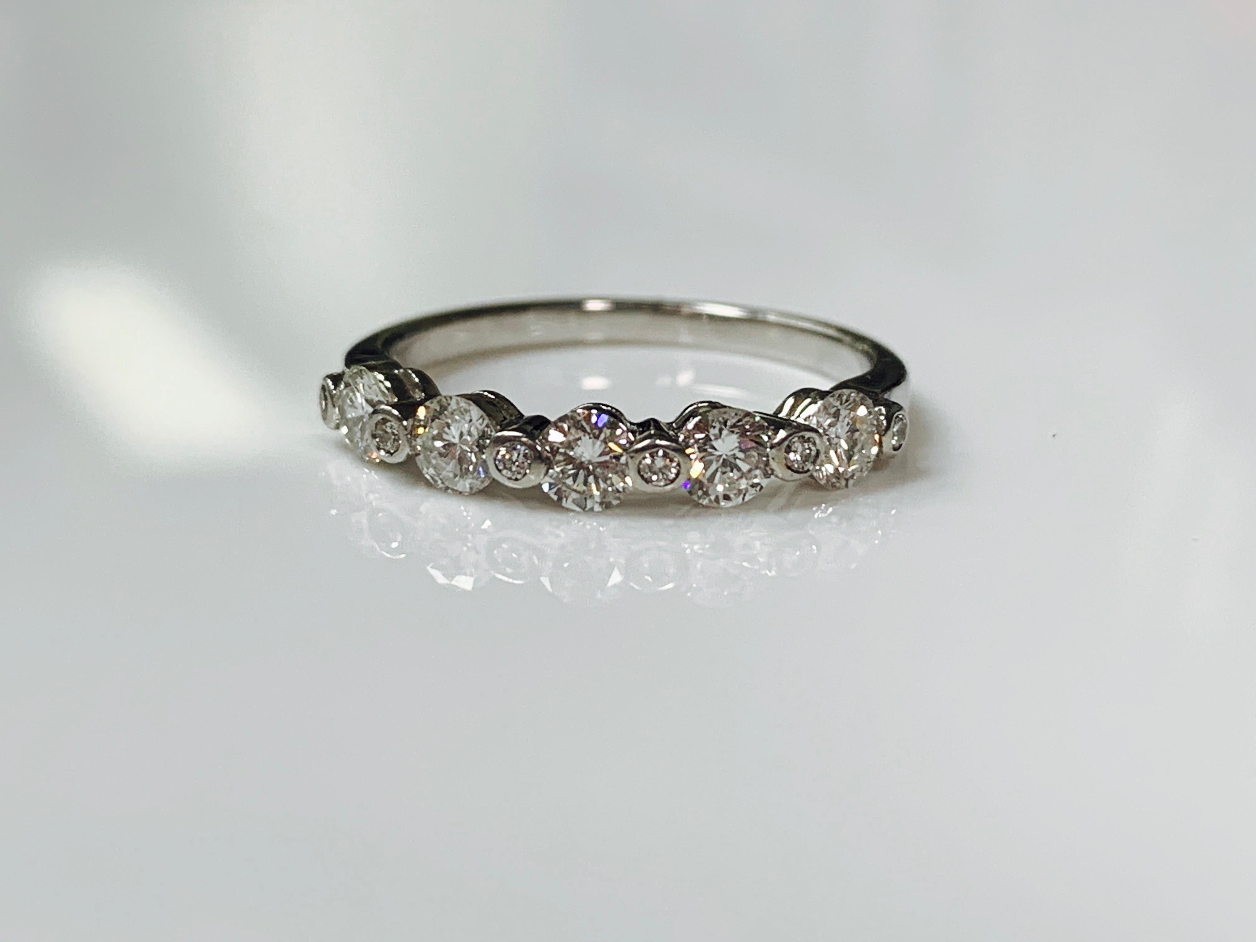 Contemporary 11-Stone Diamond Band in 18 Karat White Gold For Sale