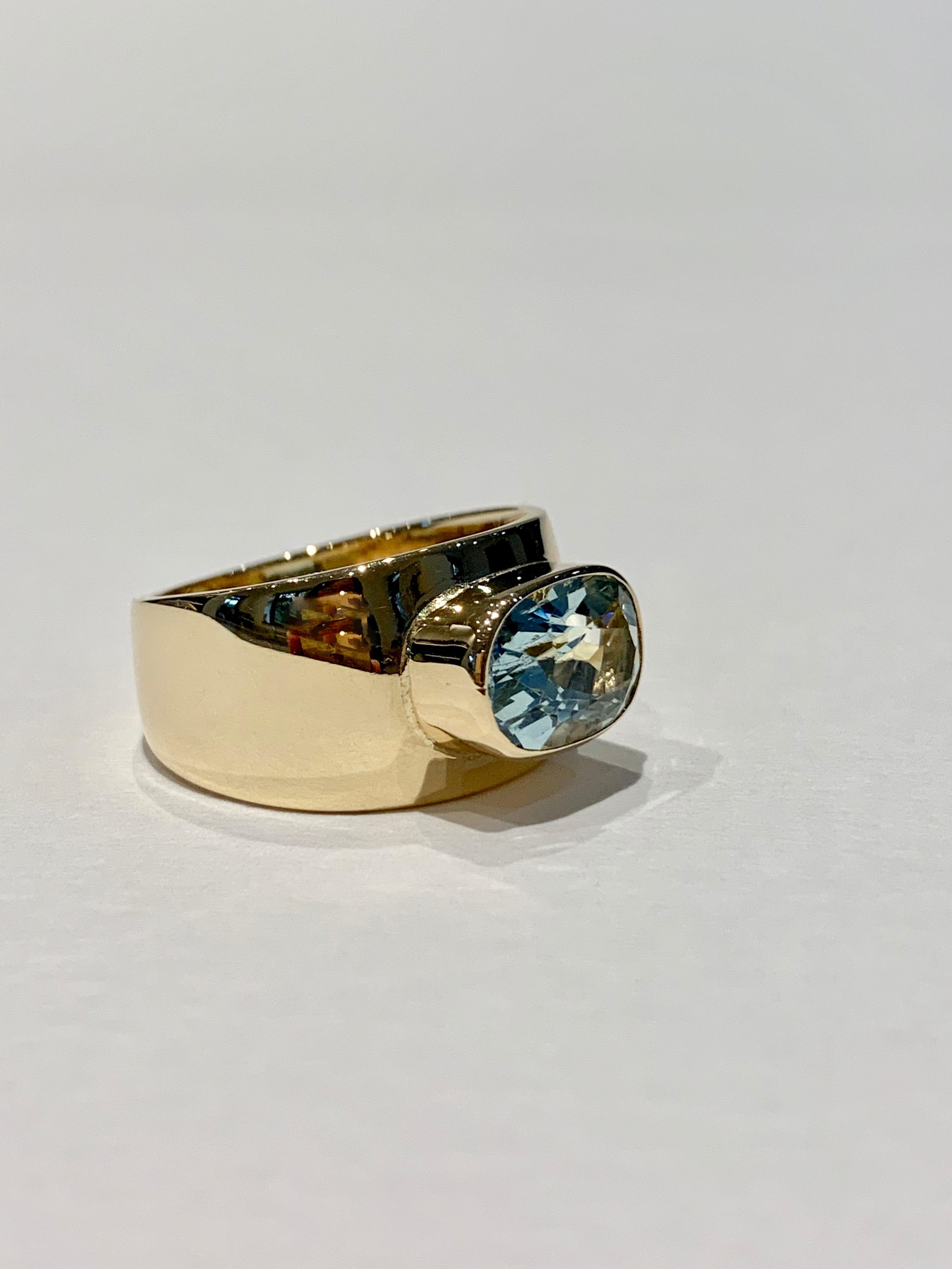 Women's Oval Aquamarine in Wide 9 Carat Yellow Gold Band For Sale