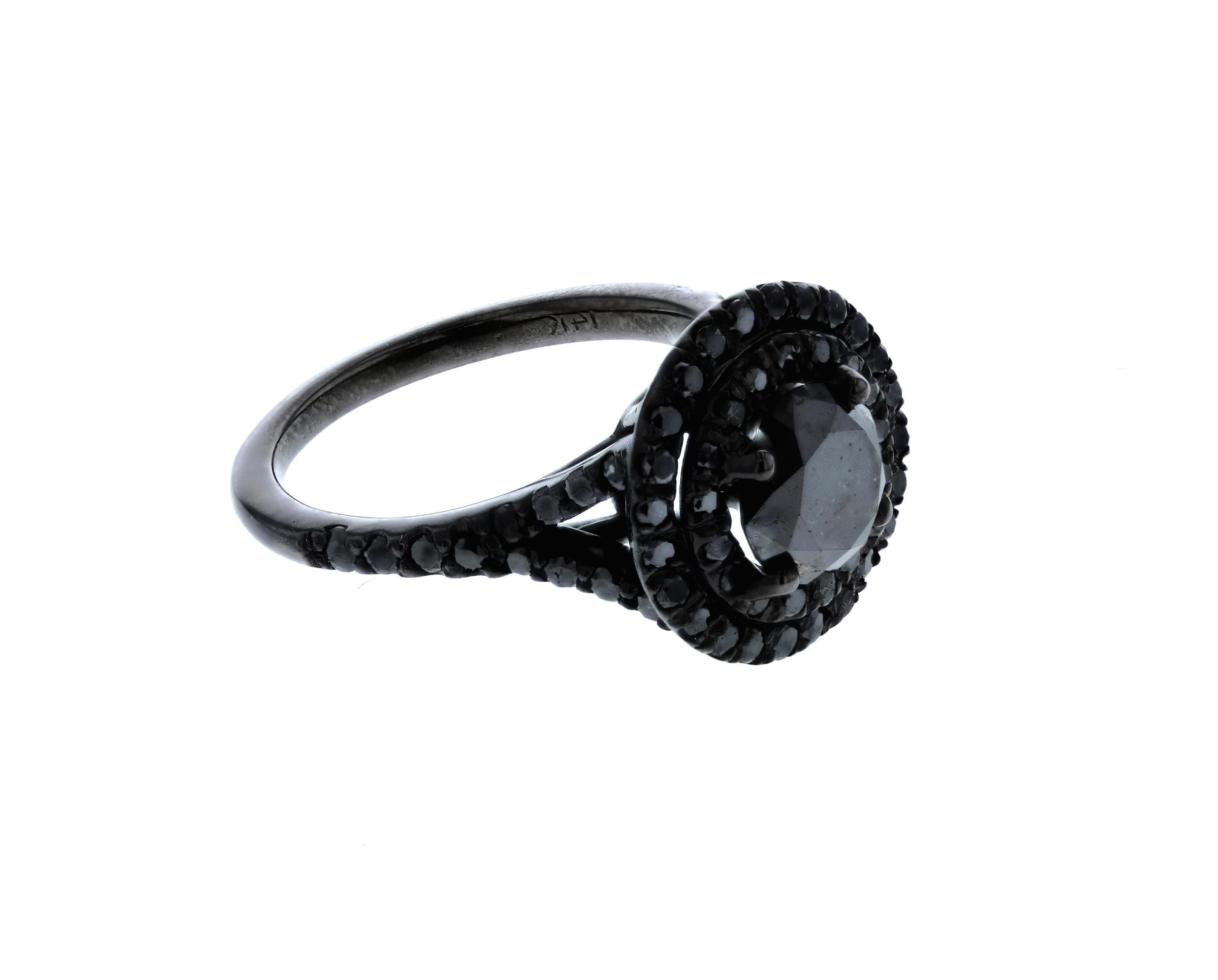 This black diamond double halo ring features a round 1.10 black diamond and 88 points of surrounding black diamonds in the halo and on the shank. A daring look, not for the faint of heart! 

Please note that each piece we make is customized to our